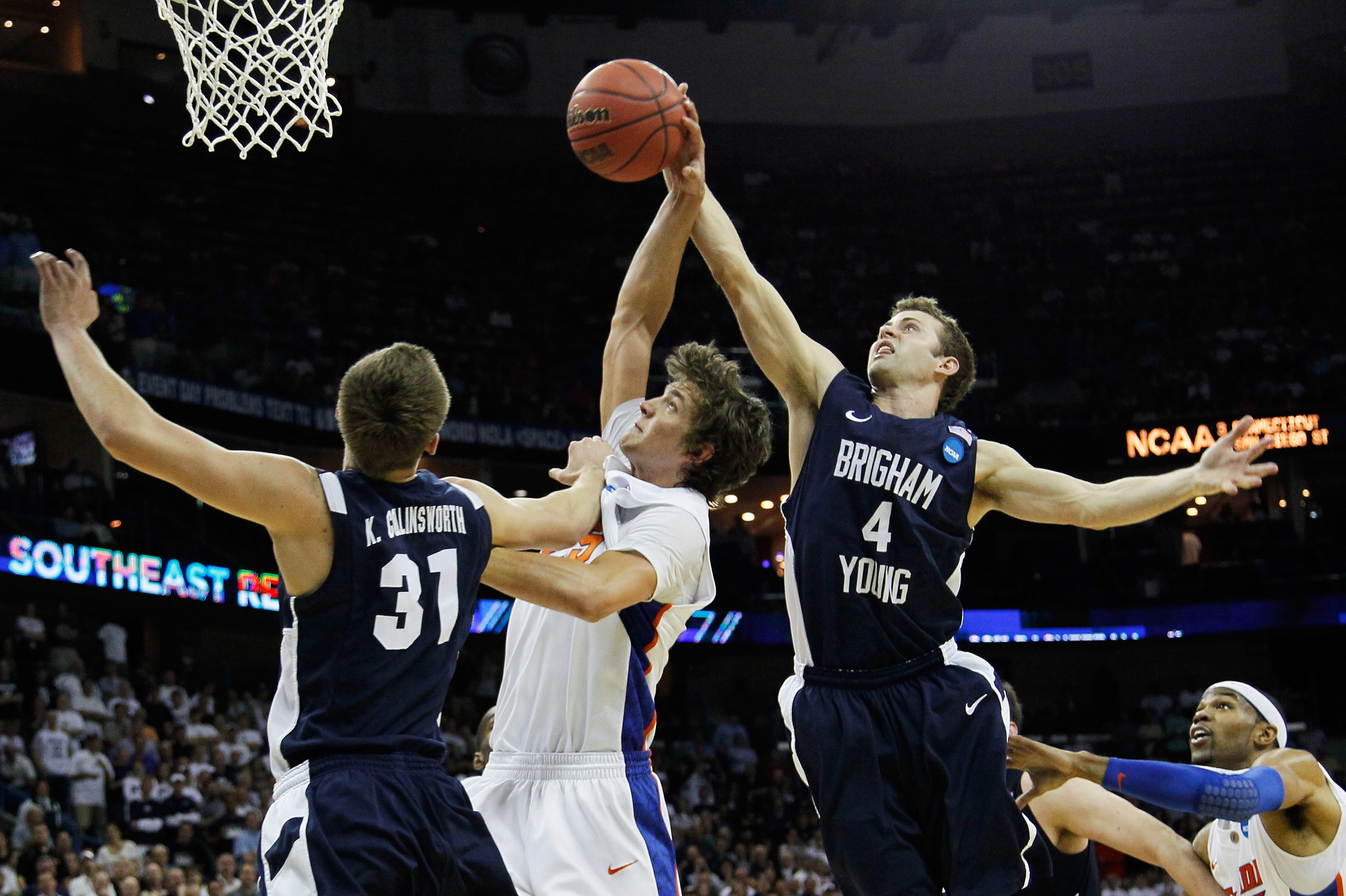 NEW ORLEANS, LA - MARCH 24: Chandler Parsons #25 of the Florida Gators goes up against Jackson Emery #4 and Kyle Collinsworth #31 of the Brigham Young Cougars during the Southeast regional of the 2011 NCAA men's basketball tournament at New Orleans Arena NEW ORLEANS, LA - MARCH 24: Chandler Parsons #25 of the Florida Gators goes up against Jackson Emery #4 and Kyle Collinsworth #31 of the Brigham Young Cougars during the Southeast regional of the 2011 NCAA men's basketball tournament at New Orleans Arena