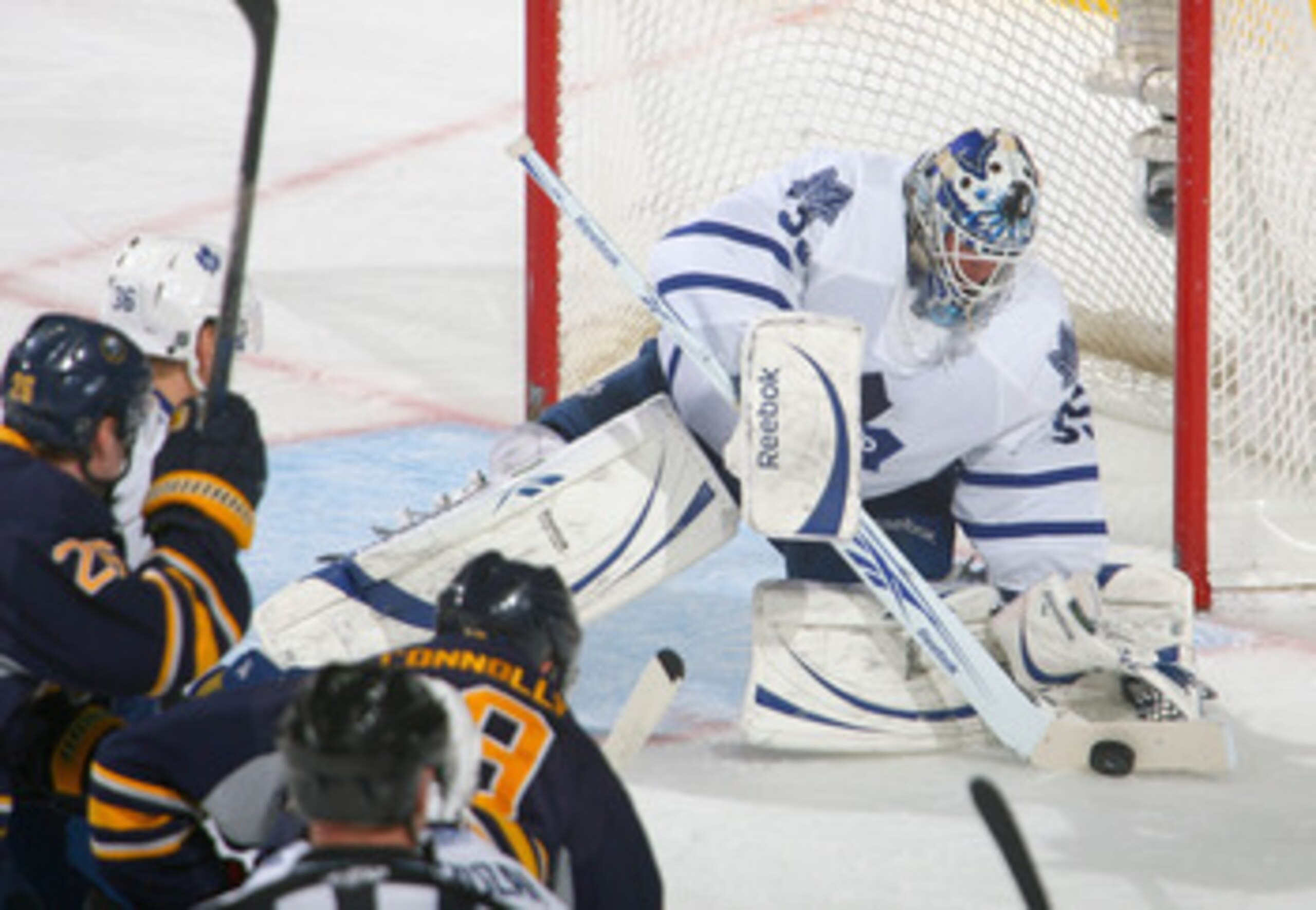 BUFFALO, NY - FEBRUARY 16: Jean-Sebastien Giguere #35 of the Toronto Maple Leafs covers up on a shot by Tim Connolly #19 of the Buffalo Sabres  at HSBC Arena on February 16, 2011 in Buffalo, New York.  (Photo by Rick Stewart/Getty Images)