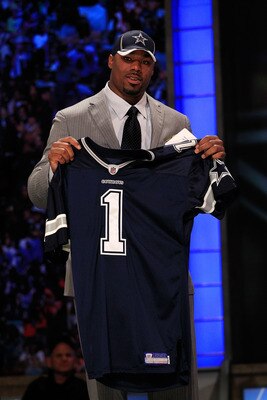 NEW YORK, NY - APRIL 28:  Tyron Smith, #9 overall pick by the Dallas Cowboys, holds up a jersey on stage during the 2011 NFL Draft at Radio City Music Hall on April 28, 2011 in New York City.  (Photo by Chris Trotman/Getty Images)