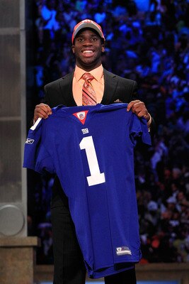 NEW YORK, NY - APRIL 28:  Prince Amukamara, #19 overall pick by the New York Giants, holds up a jersey on stage during the 2011 NFL Draft at Radio City Music Hall on April 28, 2011 in New York City.  (Photo by Chris Trotman/Getty Images)