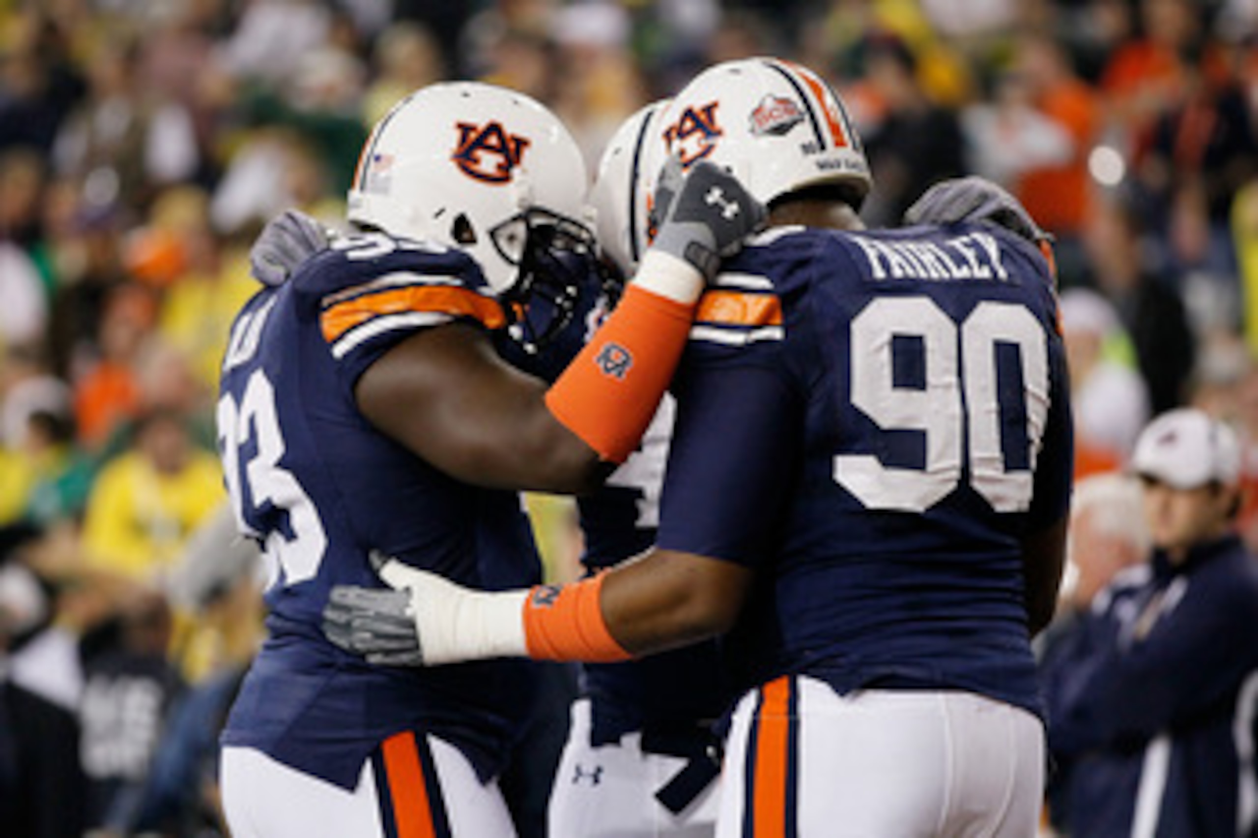 GLENDALE, AZ - JANUARY 10:  Nick Fairley #90 of the Auburn Tigers huddles with members of the Tigers defense during the Tostitos BCS National Championship Game at University of Phoenix Stadium on January 10, 2011 in Glendale, Arizona.  (Photo by Kevin C. 