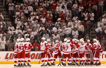 GLENDALE, AZ - APRIL 20:  Mike Modano #90 of the Detroit Red Wings celebrates with teammates after defeating the Phoenix Coyotes in Game Four of the Western Conference Quarterfinals during the 2011 NHL Stanley Cup Playoffs at Jobing.com Arena on April 20,