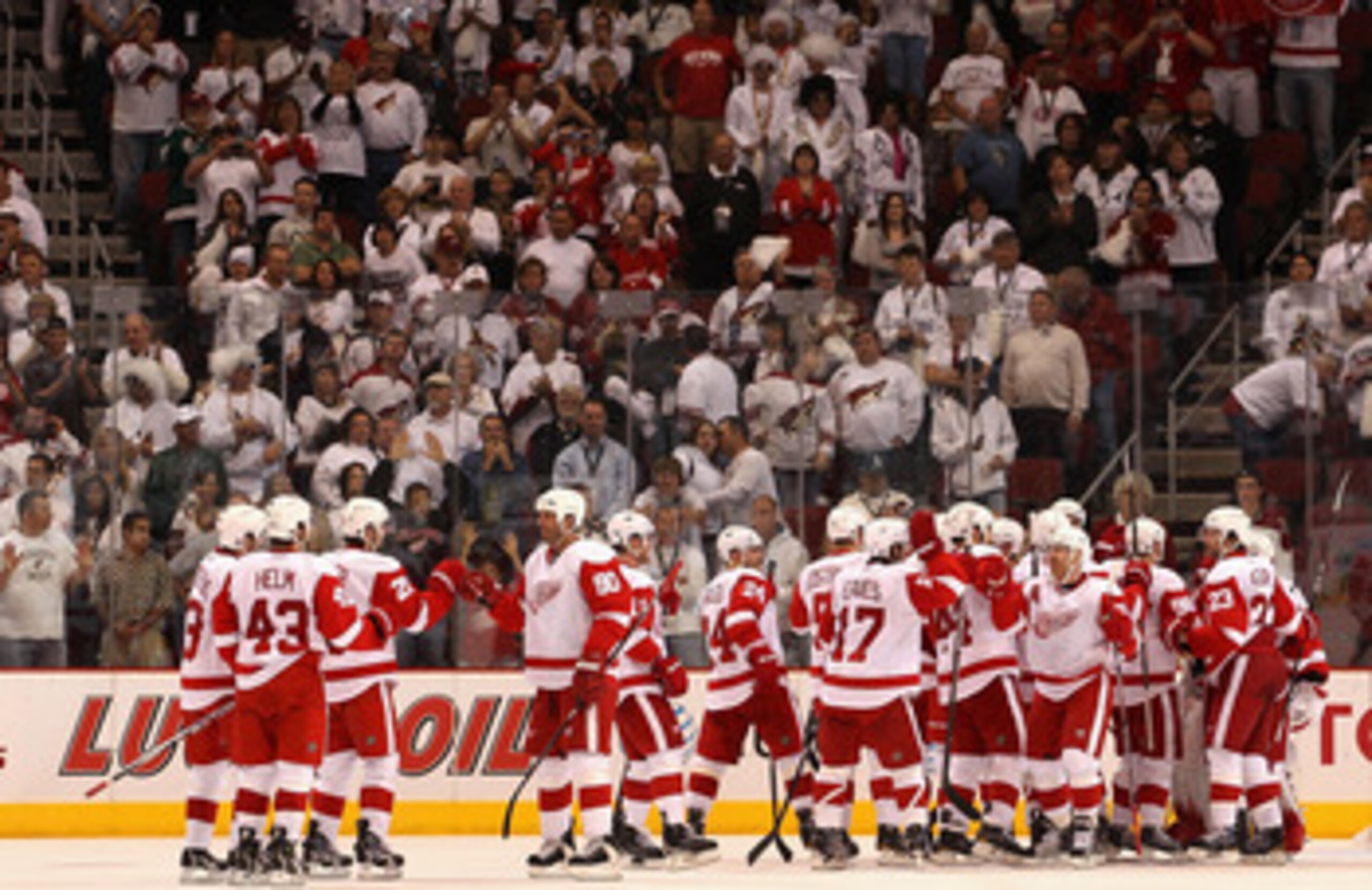 GLENDALE, AZ - APRIL 20:  Mike Modano #90 of the Detroit Red Wings celebrates with teammates after defeating the Phoenix Coyotes in Game Four of the Western Conference Quarterfinals during the 2011 NHL Stanley Cup Playoffs at Jobing.com Arena on April 20,