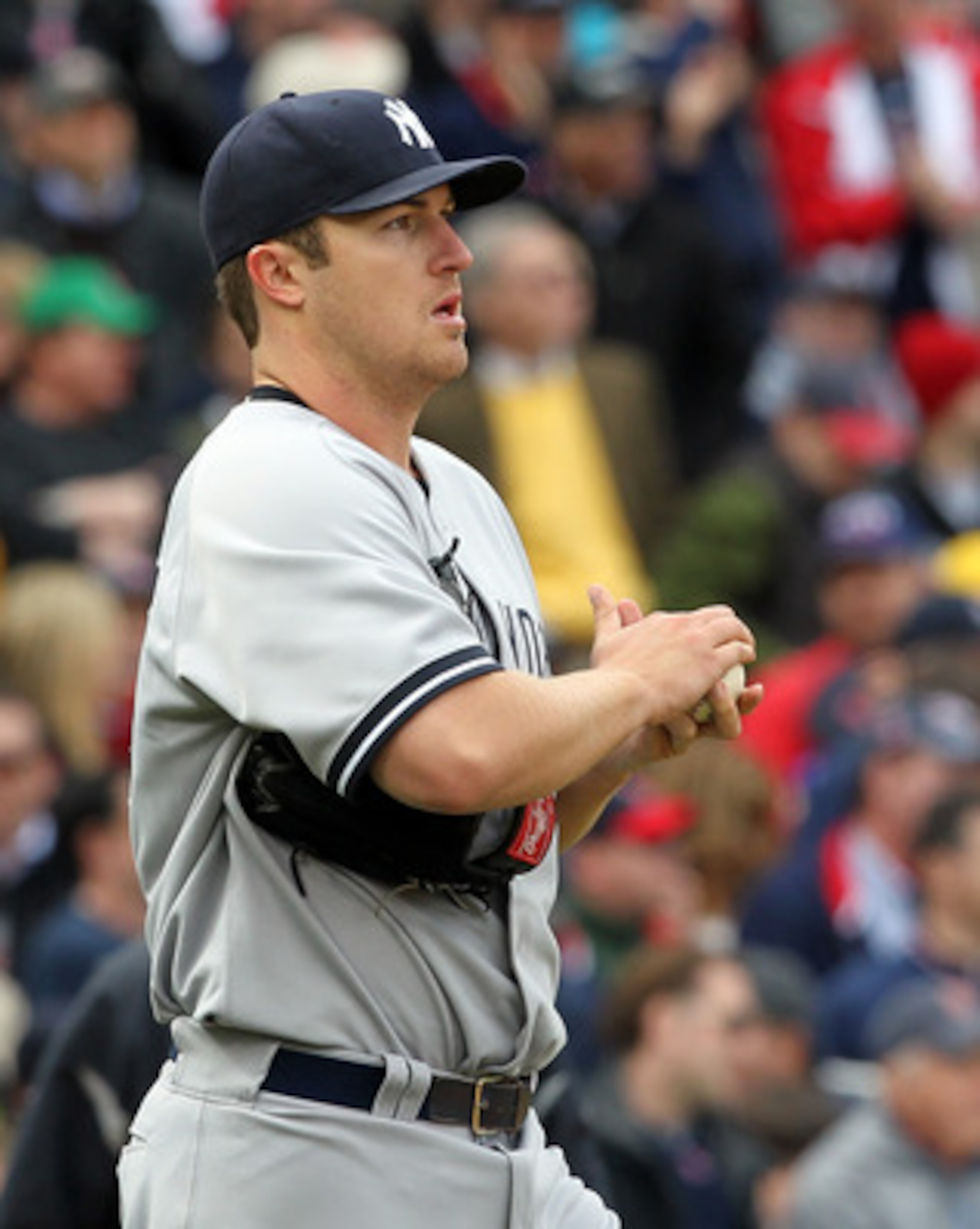 BOSTON, MA - APRIL 8:  Phil Hughes #65 of  the New York Yankees reacts during a rough second inning against the Boston Red Sox on Opening Day at Fenway Park on April 8, 2011 in Boston, Massachusetts. (Photo by Jim Rogash/Getty Images)