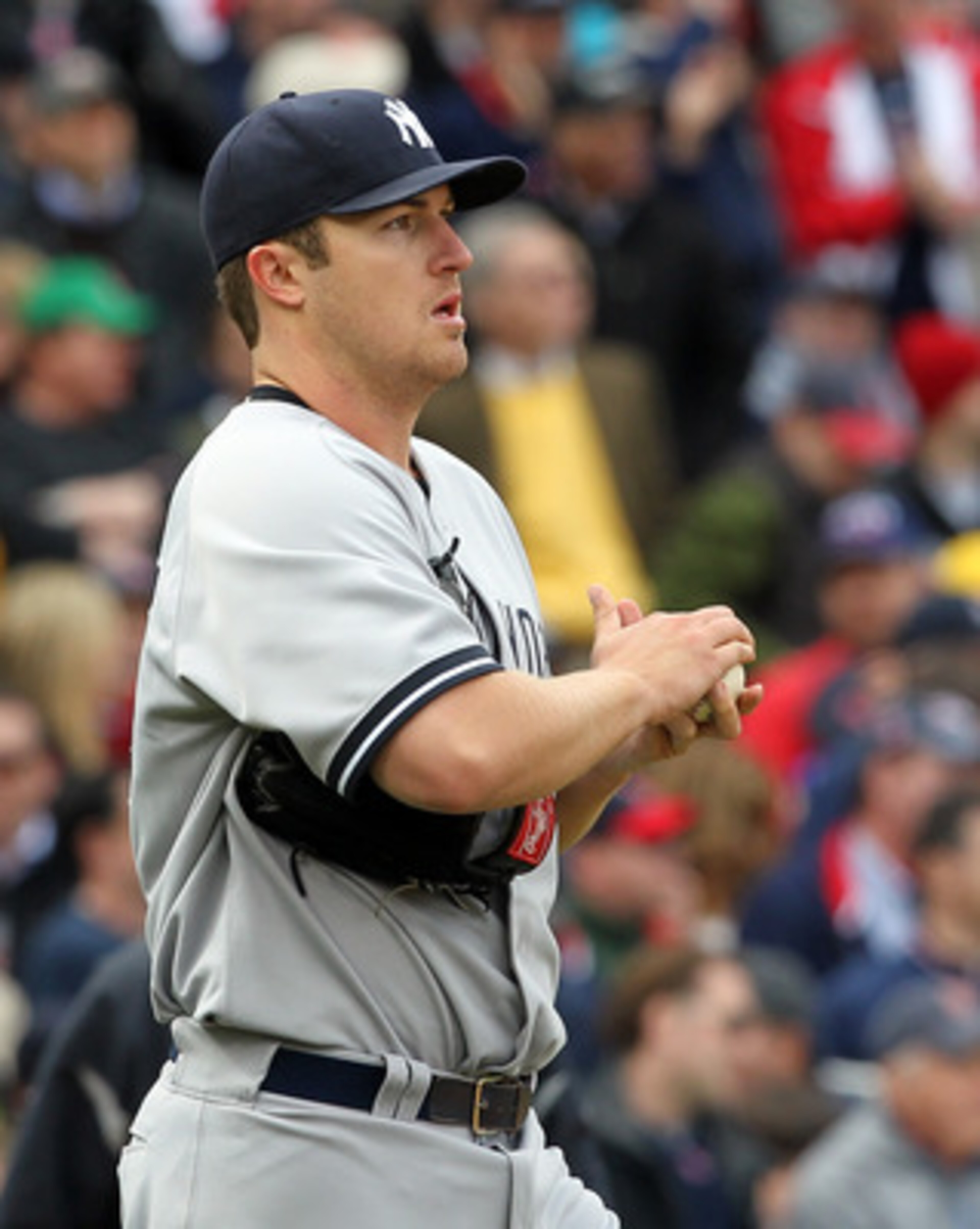 BOSTON, MA - APRIL 8:  Phil Hughes #65 of  the New York Yankees reacts during a rough second inning against the Boston Red Sox on Opening Day at Fenway Park on April 8, 2011 in Boston, Massachusetts. (Photo by Jim Rogash/Getty Images)