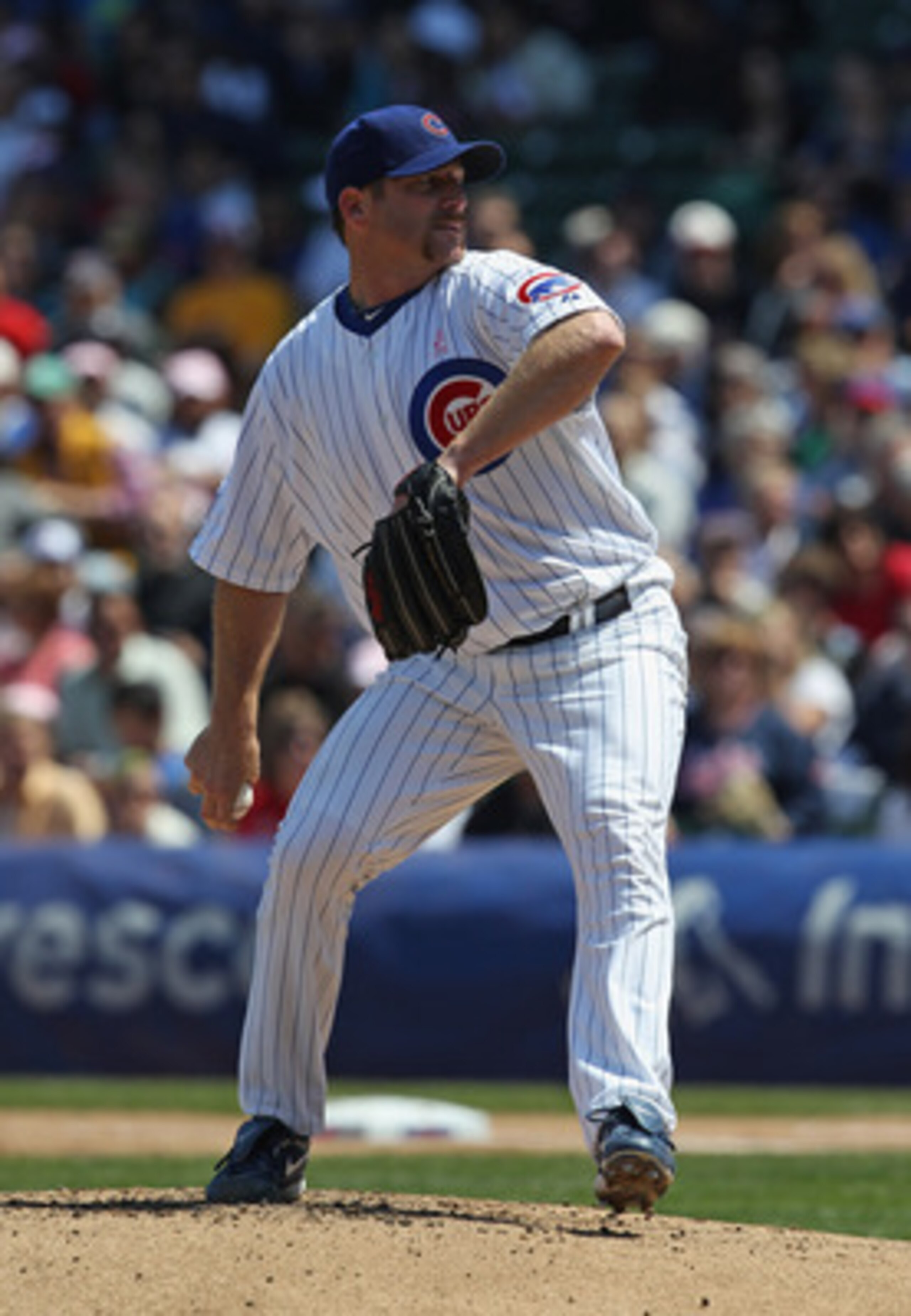 CHICAGO, IL - MAY 08: Starting pitcher Ryan Dempster #46 of the Chicago Cubs delivers the ball against the Cincinnati Reds at Wrigley Field on May 8, 2011 in Chicago, Illinois. The Reds defeated the Cubs 2-0. (Photo by Jonathan Daniel/Getty Images)
