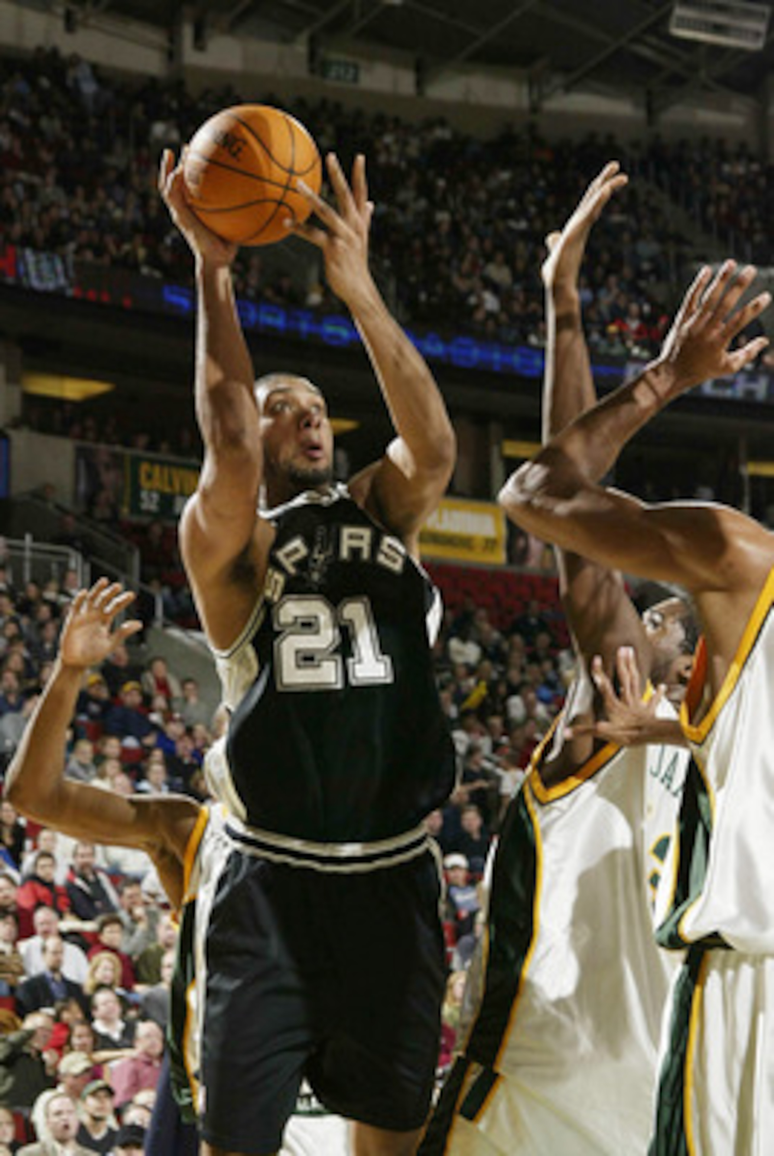 SEATTLE - DECEMBER 19:  Tim Duncan #21 of the San Antonio Spurs shoots against the Seattle SuperSonics on December 19 2003 at Key Arena in Seattle, Washington. DIGITAL IMAGE NOTE TO USER: User expressly acknowledges and agrees that, by downloading and/or