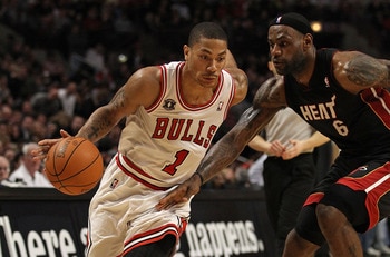 CHICAGO, IL - FEBRUARY 24: Derrick Rose #1 of the Chicago Bulls drives against LeBron James #6 of the Miami Heat at the United Center on February 24, 2011 in Chicago, Illinois. The Bulls defeated the Heat 93-89. NOTE TO USER: User expressly acknowledges a