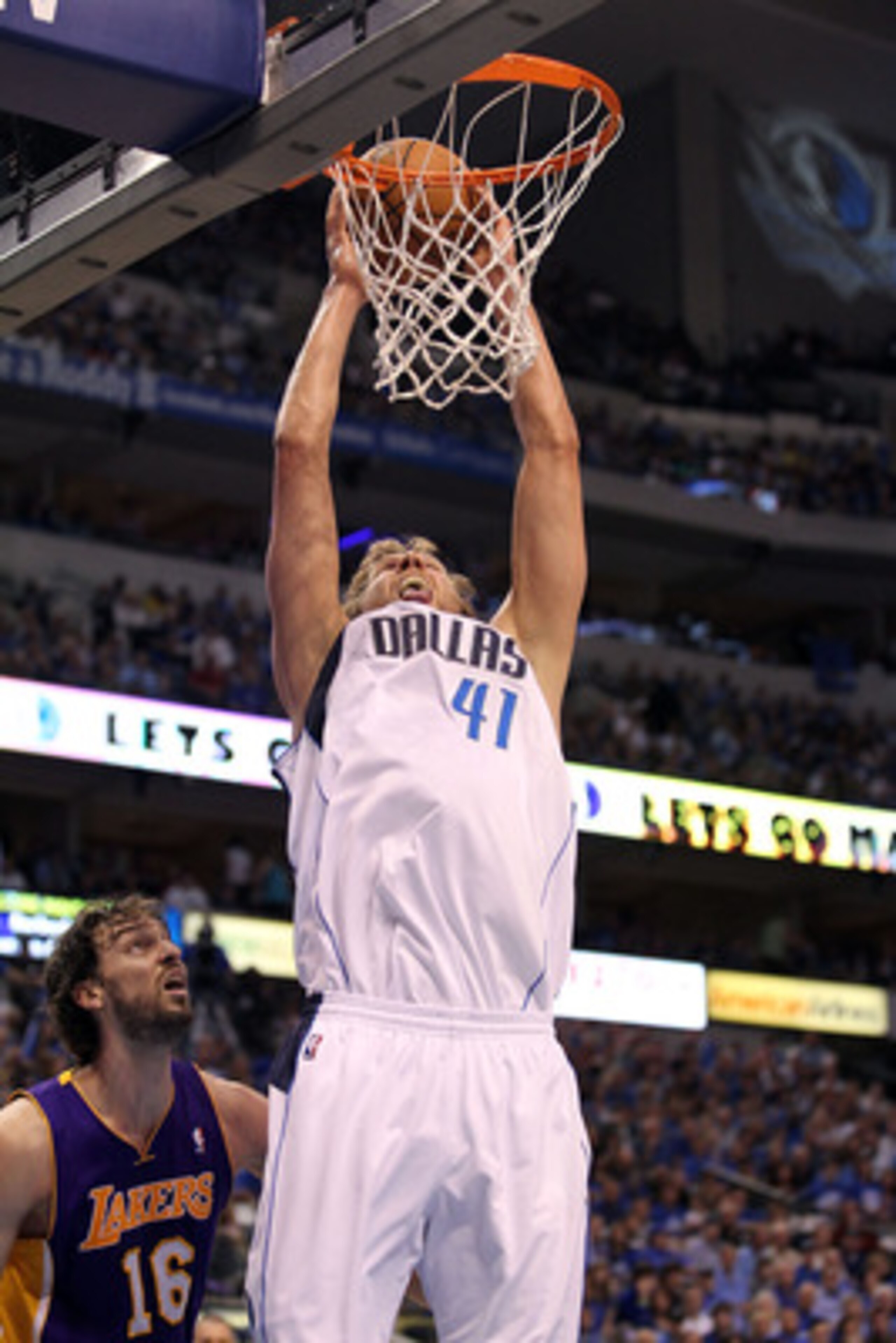 DALLAS, TX - MAY 08:  Forward Dirk Nowitzki #41 of the Dallas Mavericks gets the slam dunk against Pau Gasol #16 of the Los Angeles Lakers in Game Four of the Western Conference Semifinals during the 2011 NBA Playoffs on May 8, 2011 at American Airlines C