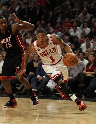 CHICAGO, IL - FEBRUARY 24: Derrick Rose #1 of the Chicago Bulls drives past Mario Chalmers #15 of the Miami Heat at the United Center on February 24, 2011 in Chicago, Illinois. The Bulls defeated the Heat 93-89. NOTE TO USER: User expressly acknowledges a