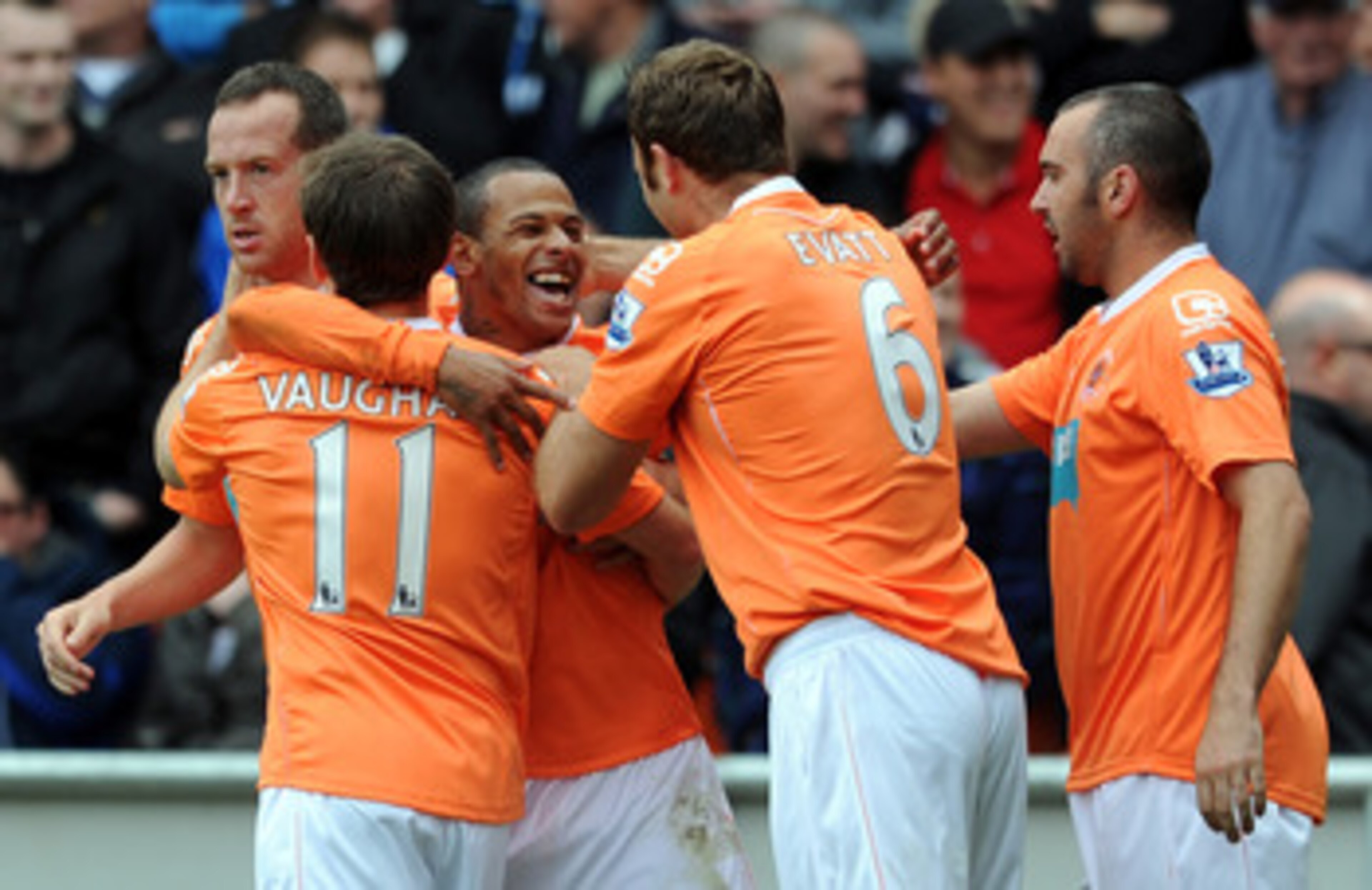 BLACKPOOL, ENGLAND - MAY 14:  DJ Campbell of Blackpool is congratulated by his team-mates after scoring the opening goal during the Barclays Premier League match between Blackpool and Bolton Wanderers at Bloomfield Road on May 14, 2011 in Blackpool, Engla