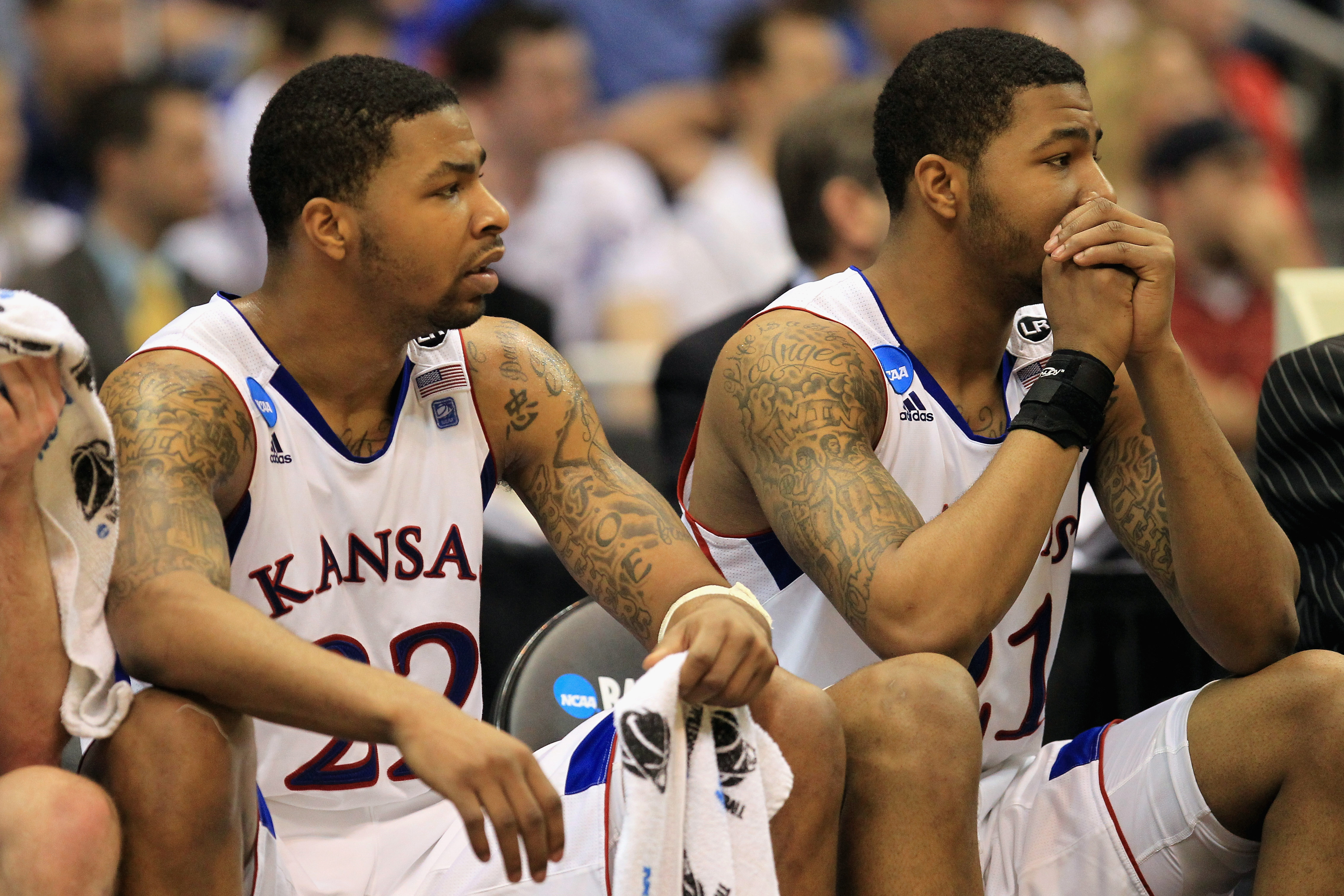 SAN ANTONIO, TX - MARCH 27:  (L-R) Marcus Morris #22 and Markieff Morris #21 of the Kansas Jayhawks look on during the southwest regional final of the 2011 NCAA men's basketball tournament against the Virginia Commonwealth Rams at the Alamodome on March 2