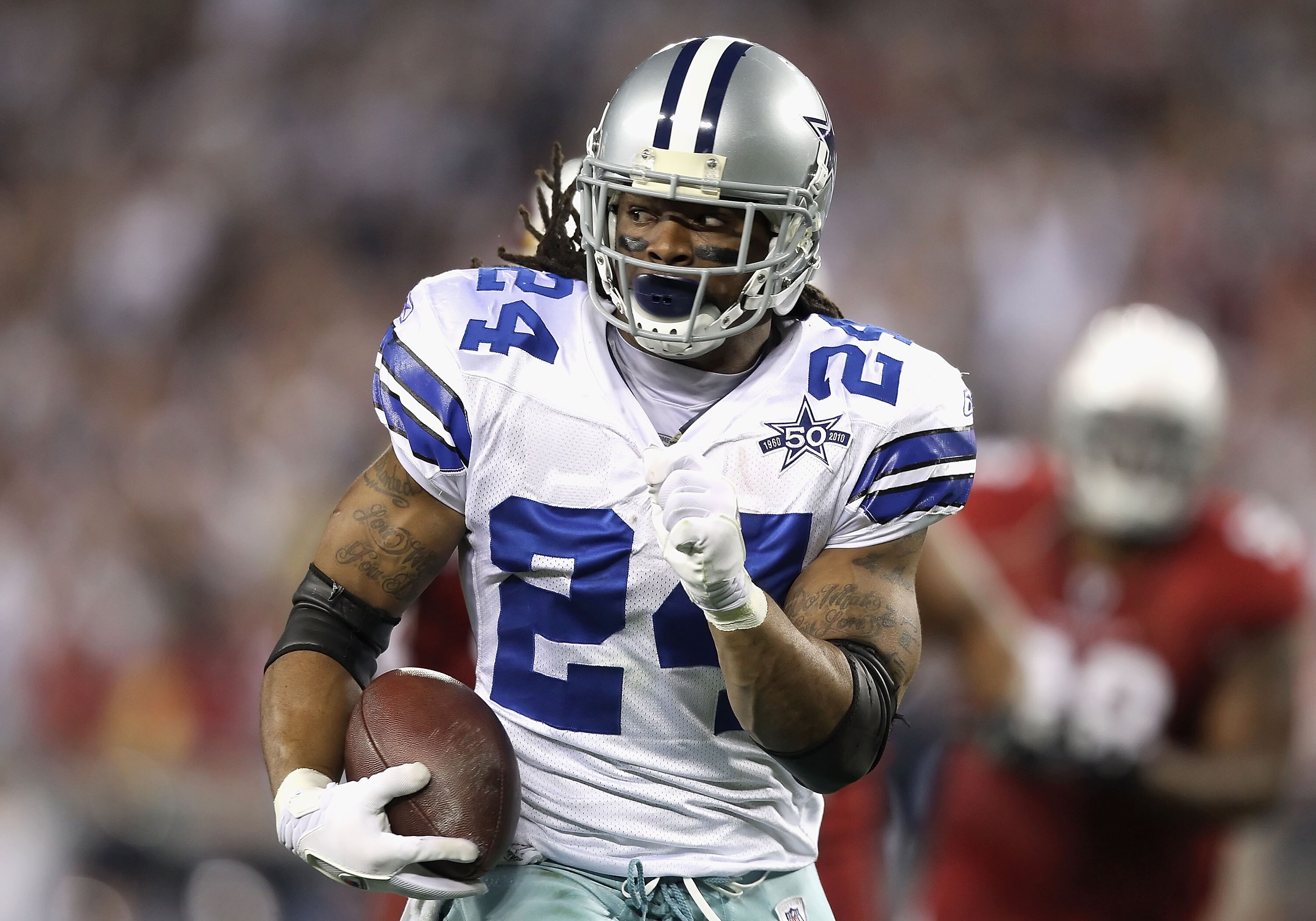 GLENDALE, AZ - DECEMBER 25:  Runningback Marion Barber #24 of the Dallas Cowboys rushes the football during the NFL game against the Arizona Cardinals at the University of Phoenix Stadium on December 25, 2010 in Glendale, Arizona.  The Cardinals defeated 