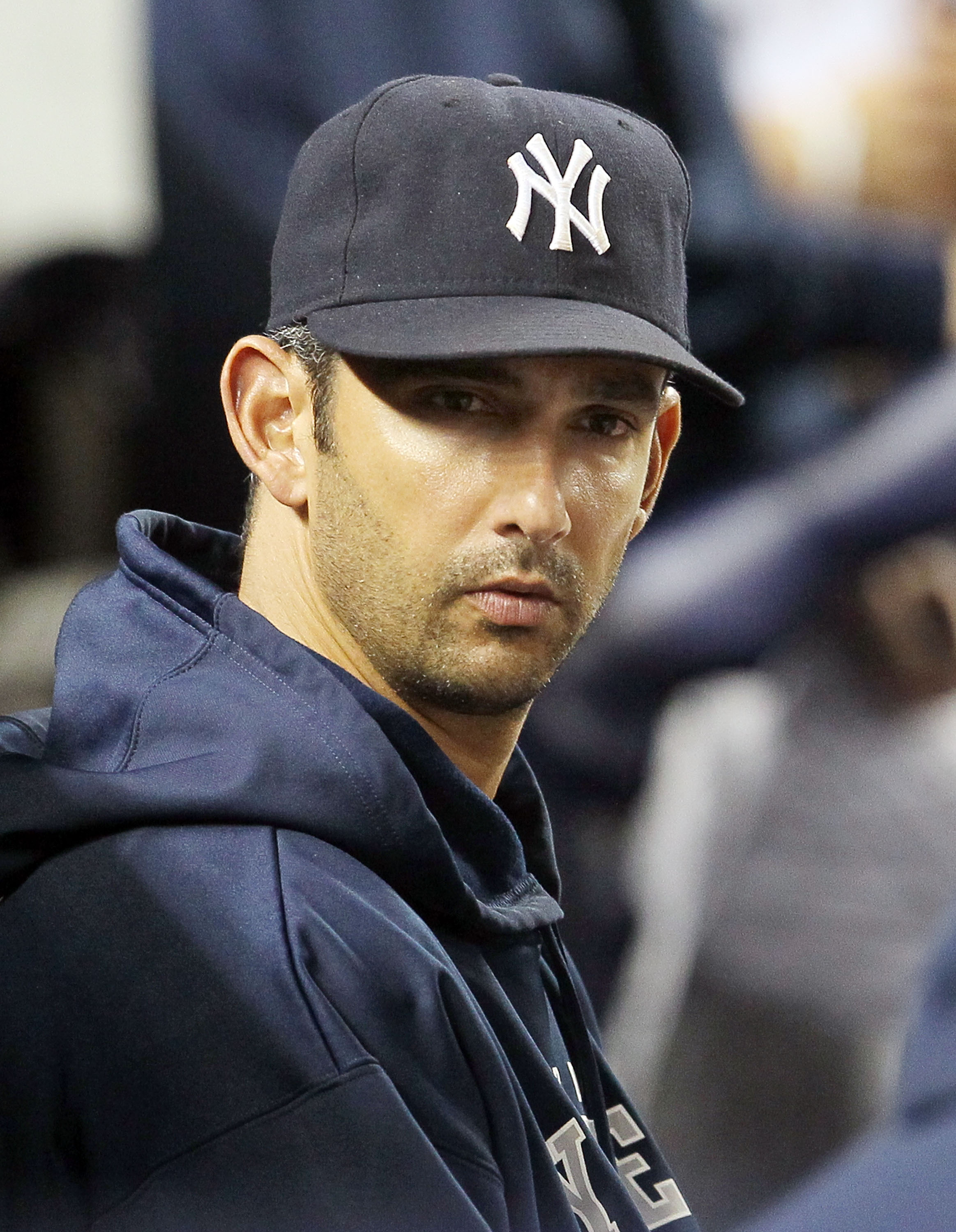 NEW YORK, NY - MAY 14:  Jorge Posada #20 of the New York Yankees looks on from the bench during the game against the Boston Red Sox on May 14, 2011 at Yankee Stadium in the Bronx borough of New York City. Posada pulled himself from the starting lineup pri