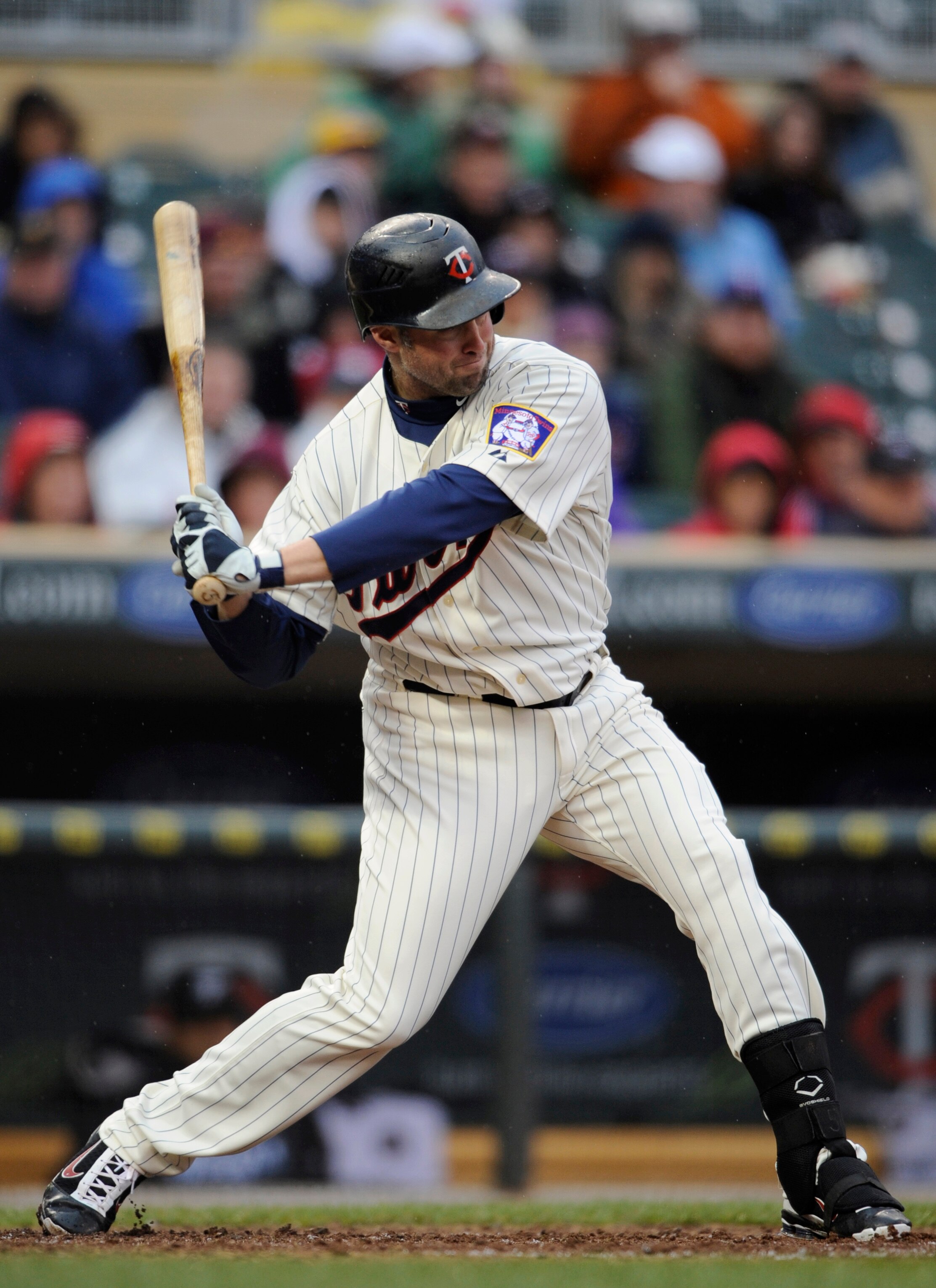 MINNEAPOLIS, MN - MAY 14: Michael Cuddyer #5 of the Minnesota Twins hits a solo home run against the Toronto Blue Jays in the sixth inning on May 14, 2011 at Target Field in Minneapolis, Minnesota. Blue Jays defeated the Twins 9-3 in eleven innings. (Phot