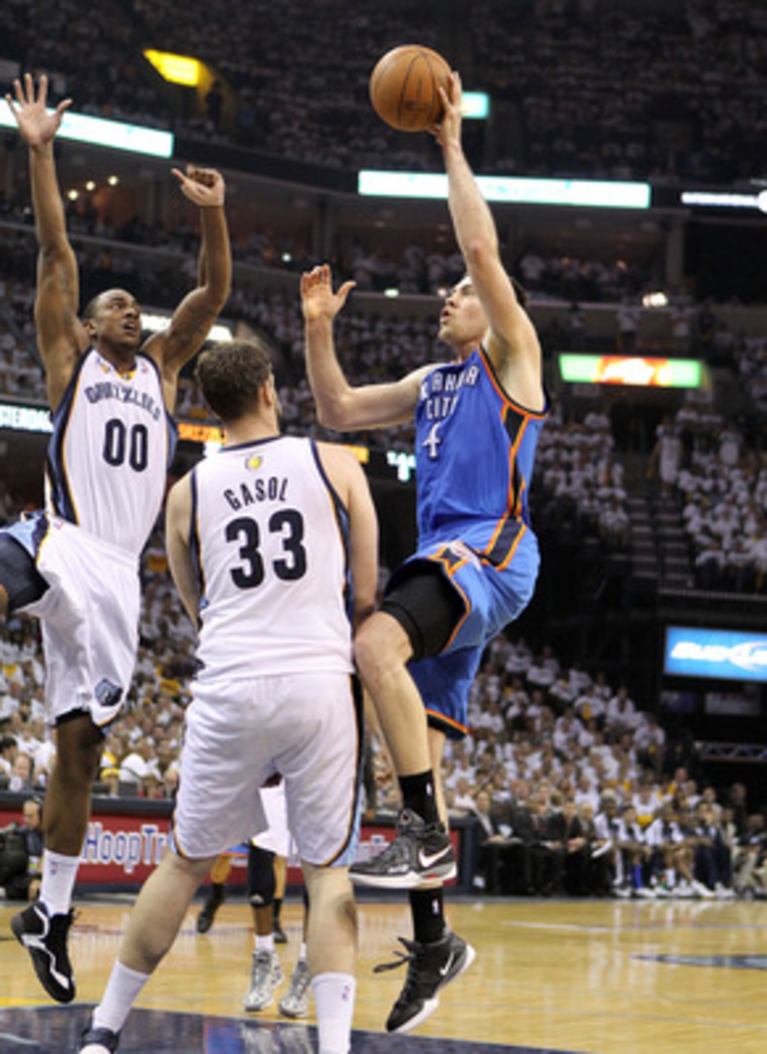 MEMPHIS, TN - MAY 09:  Nick Collison #4 of the Oklahoma City Thunder shoots the ball while defended by Marc Gasol #33 of the Memphis Grizzlies in Game Four of the Western Conference Semifinals in the 2011 NBA Playoffs at FedExForum on May 9, 2011 in Memph