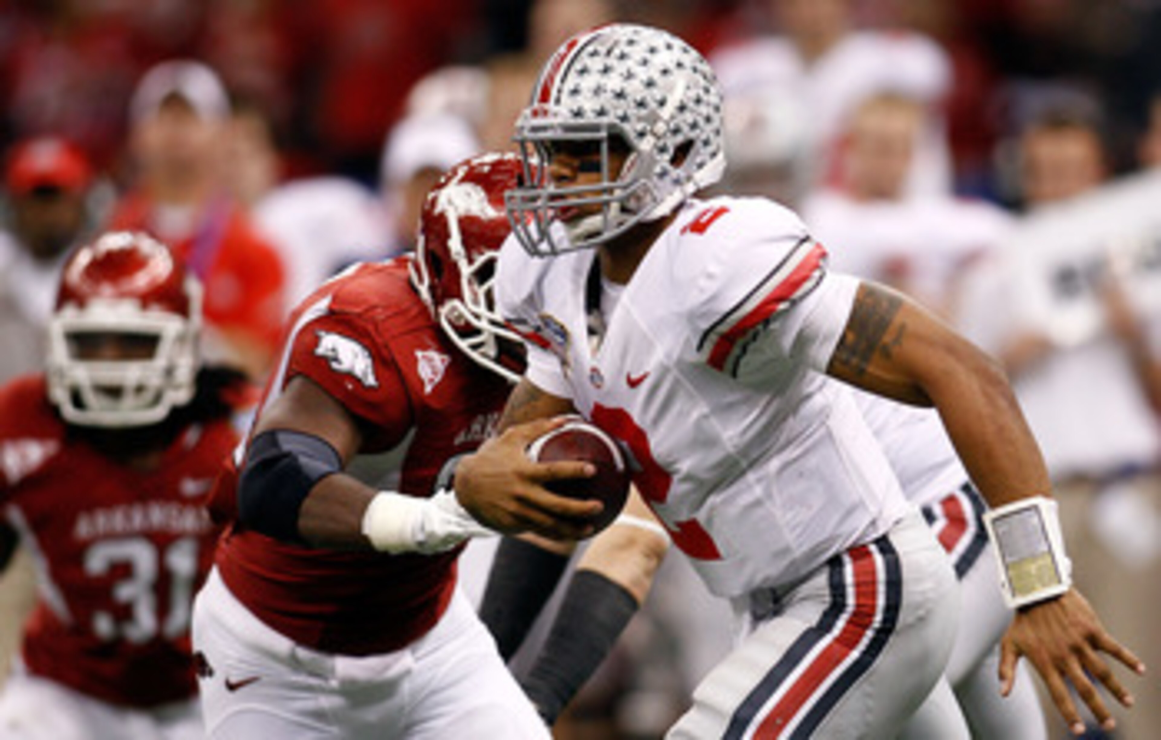 NEW ORLEANS, LA - JANUARY 04:  Quarterback Terrelle Pryor #2 of the Ohio State Buckeyes looks to run against the Arkansas Razorbacks during the Allstate Sugar Bowl at the Louisiana Superdome on January 4, 2011 in New Orleans, Louisiana.  (Photo by Chris G