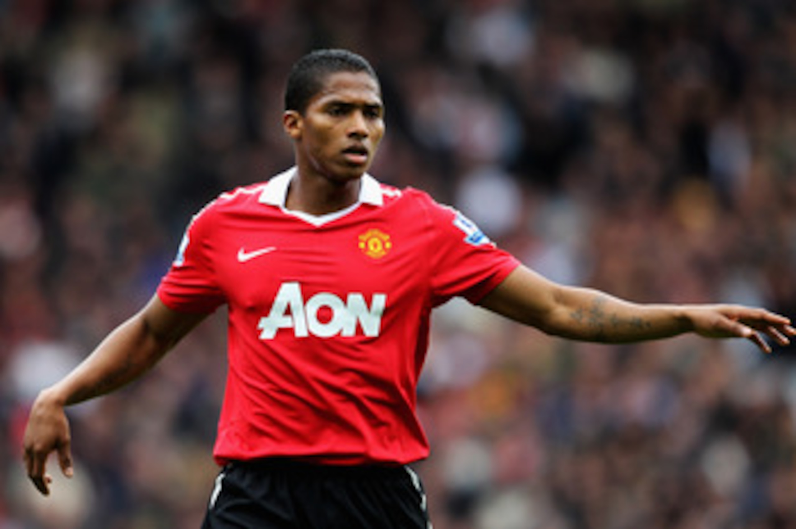 BLACKBURN, ENGLAND - MAY 14:  Antonio Valencia of Manchester United speaks to a team mate during the Barclays Premier League match between Blackburn Rovers and Manchester United at Ewood park on May 14, 2011 in Blackburn, England.  (Photo by Dean Mouhtaro