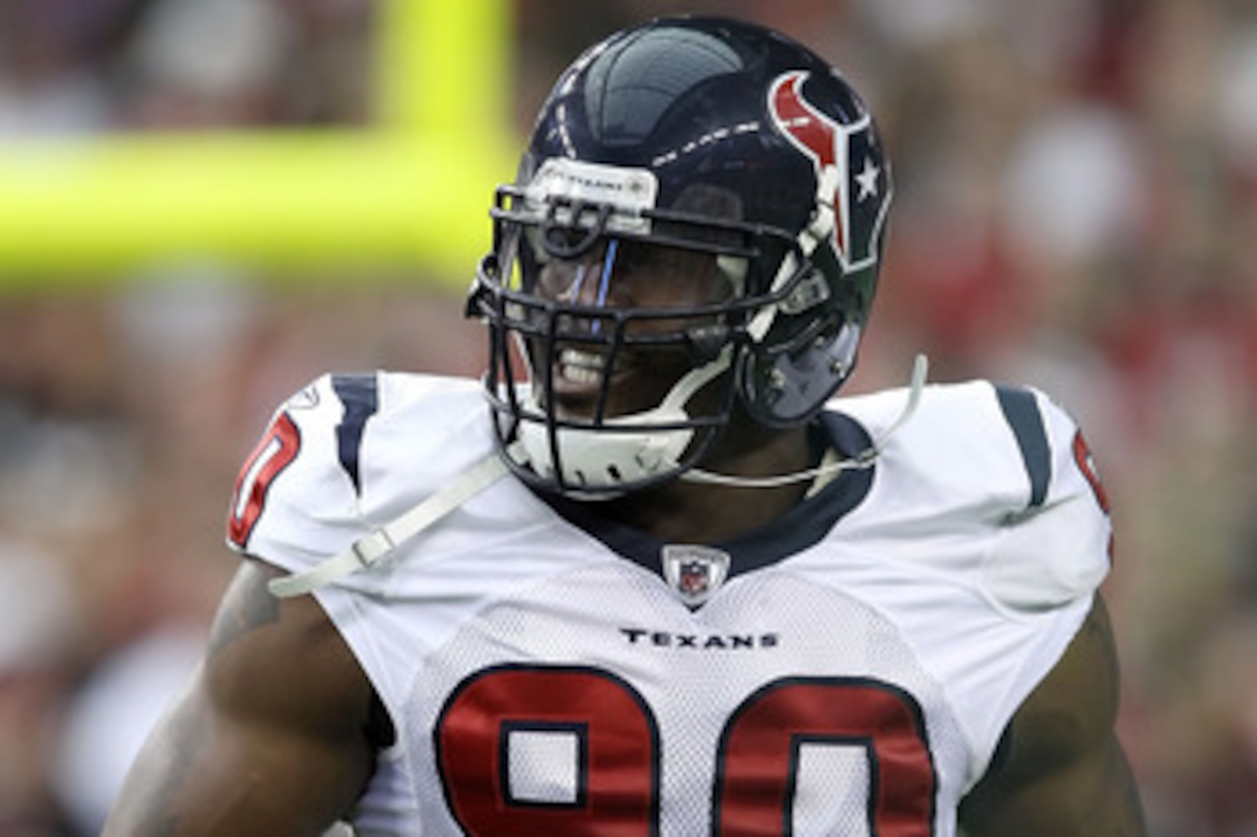 GLENDALE, AZ - AUGUST 14:  Defensive end Mario Williams #90 of the Houston Texans celebrates after a first quarter sack agianst the Arizona Cardinals during preseason NFL game at the University of Phoenix Stadium on August 14, 2010 in Glendale, Arizona.