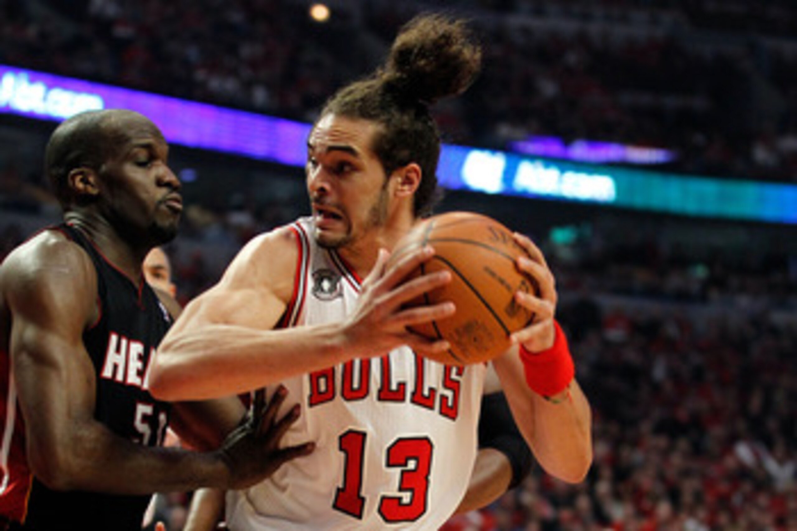 CHICAGO, IL - MAY 15:  Joakim Noah #13 of the Chicago Bulls moves the ball in the post against Joel Anthony #50 of the Miami Heat in Game One of the Eastern Conference Finals during the 2011 NBA Playoffs on May 15, 2011 at the United Center in Chicago, Il