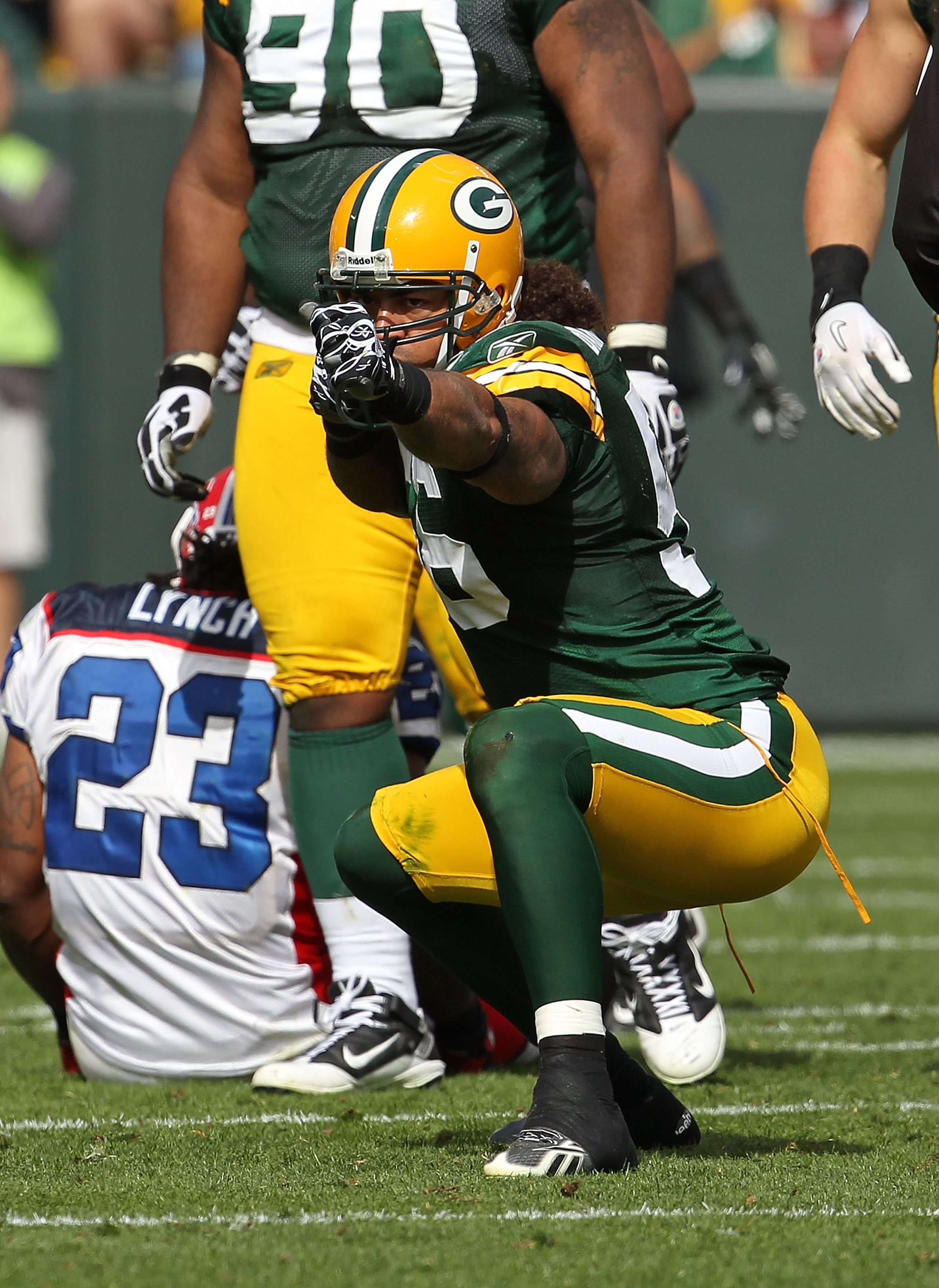 GREEN BAY, WI - SEPTEMBER 19: Nick Barnett #56 of the Green Bay Packers celebrates a defensive stop against Marshawn Lynch #23 of the Buffalo Bills at Lambeau Field on September 19, 2010 in Green Bay, Wisconsin. The Packers defeated the Bills 34-7. (Photo GREEN BAY, WI - SEPTEMBER 19: Nick Barnett #56 of the Green Bay Packers celebrates a defensive stop against Marshawn Lynch #23 of the Buffalo Bills at Lambeau Field on September 19, 2010 in Green Bay, Wisconsin. The Packers defeated the Bills 34-7. (Photo