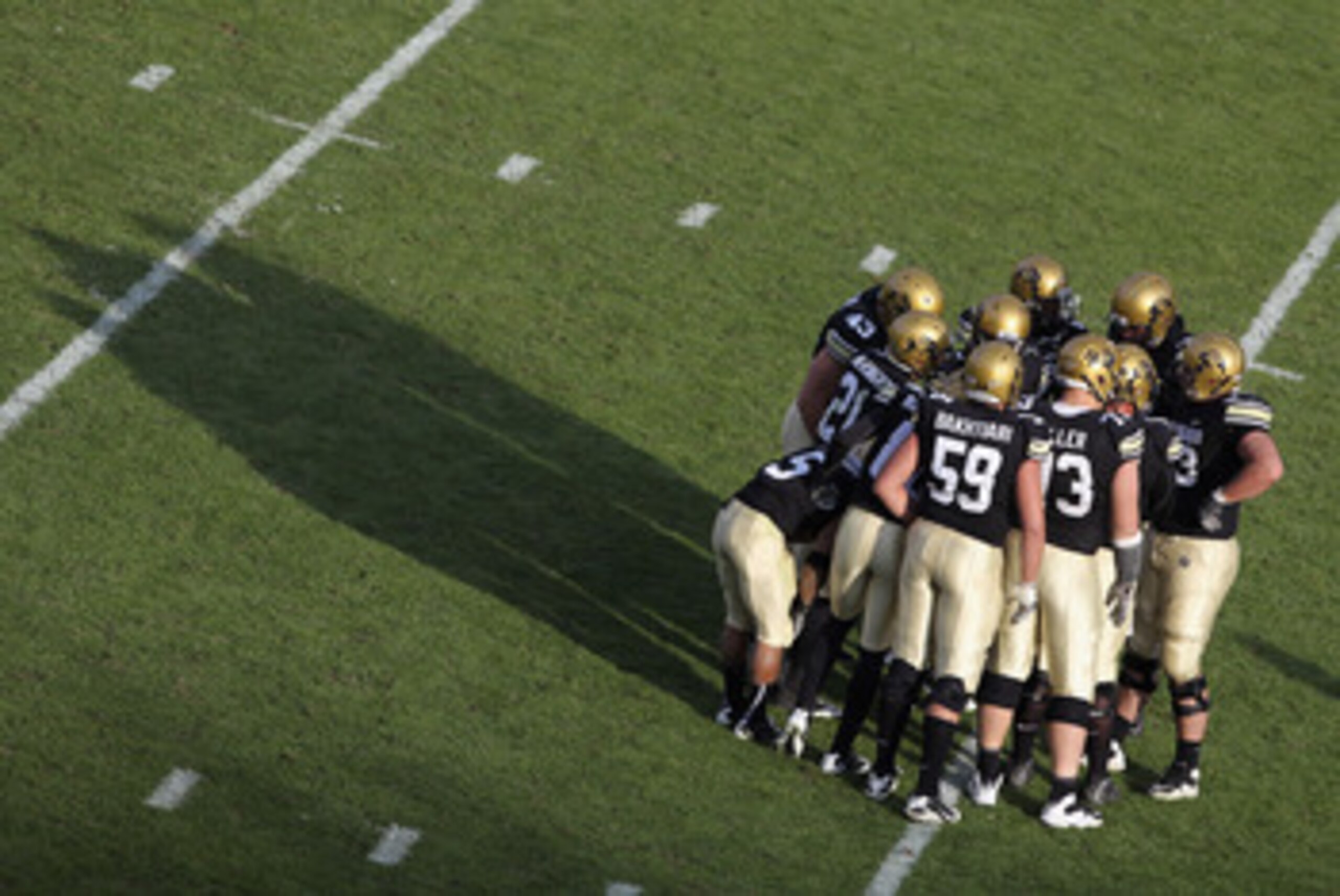 BOULDER, CO - NOVEMBER 20: The Colorado Buffaloes offenses huddles up against the Kansas State Wildcats at Folsom Field on November 20, 2010 in Boulder, Colorado. Colorado defeated Kansas State 44-36. (Photo by Doug Pensinger/Getty Images) BOULDER, CO - NOVEMBER 20: The Colorado Buffaloes offenses huddles up against the Kansas State Wildcats at Folsom Field on November 20, 2010 in Boulder, Colorado. Colorado defeated Kansas State 44-36. (Photo by Doug Pensinger/Getty Images)