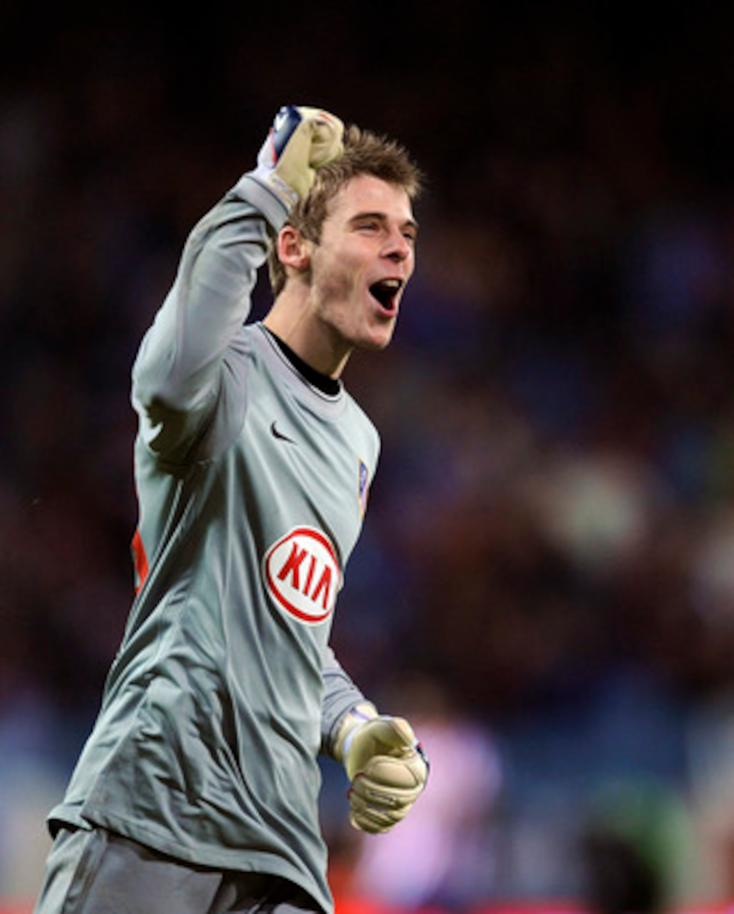 MADRID, SPAIN - FEBRUARY 04:  David de Gea of Atletico Madrid celebrates after his side scored their fourth goal against Racing Santander during the Copa del Rey semi-final, first leg match between Atletico Madrid and Racing Santander at the Vicente Calde