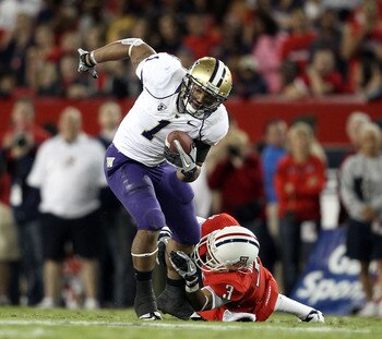 TUCSON, AZ - OCTOBER 23:  Runningback Chris Polk #1 of the Washington Huskies rushes the football during the college football game against the Arizona Wildcats at Arizona Stadium on October 23, 2010 in Tucson, Arizona. The Wildcats defeated the Huskies 44