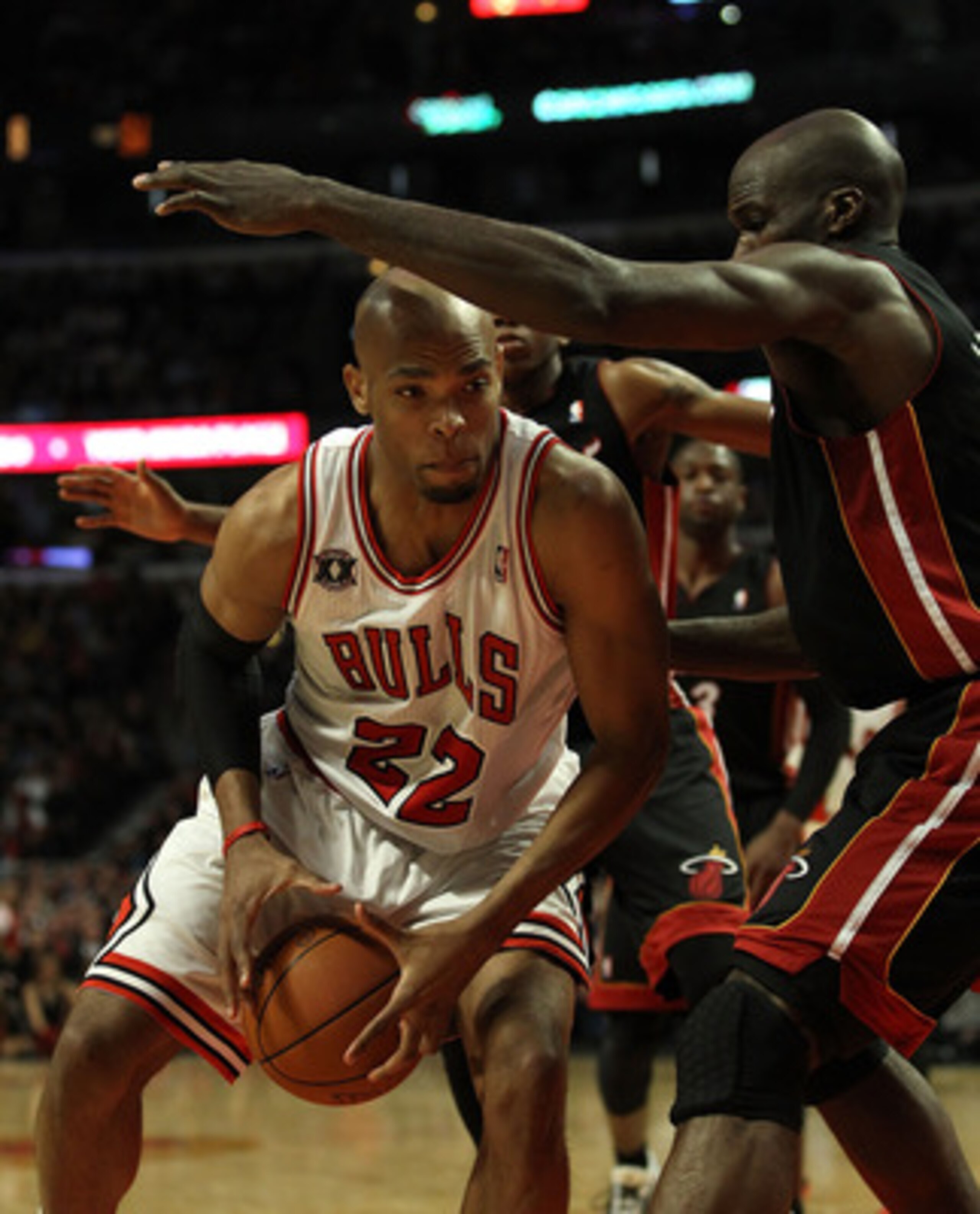 CHICAGO, IL - FEBRUARY 24: Taj Gibson #22 of the Chicago Bulls moves against Joel Anthony #50 of the Miami Heat at the United Center on February 24, 2011 in Chicago, Illinois. The Bulls defeated the Heat 93-89. NOTE TO USER: User expressly acknowledges an