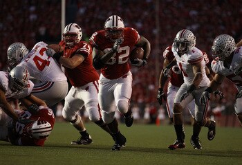 MADISON, WI - OCTOBER 16: John Clay #32 of the Wisconsin Badgers runs for a touchdown against the Ohio State Buckeyes at Camp Randall Stadium on October 16, 2010 in Madison, Wisconsin. Wisconsin defeated Ohio State 31-18. (Photo by Jonathan Daniel/Getty I MADISON, WI - OCTOBER 16: John Clay #32 of the Wisconsin Badgers runs for a touchdown against the Ohio State Buckeyes at Camp Randall Stadium on October 16, 2010 in Madison, Wisconsin. Wisconsin defeated Ohio State 31-18. (Photo by Jonathan Daniel/Getty I