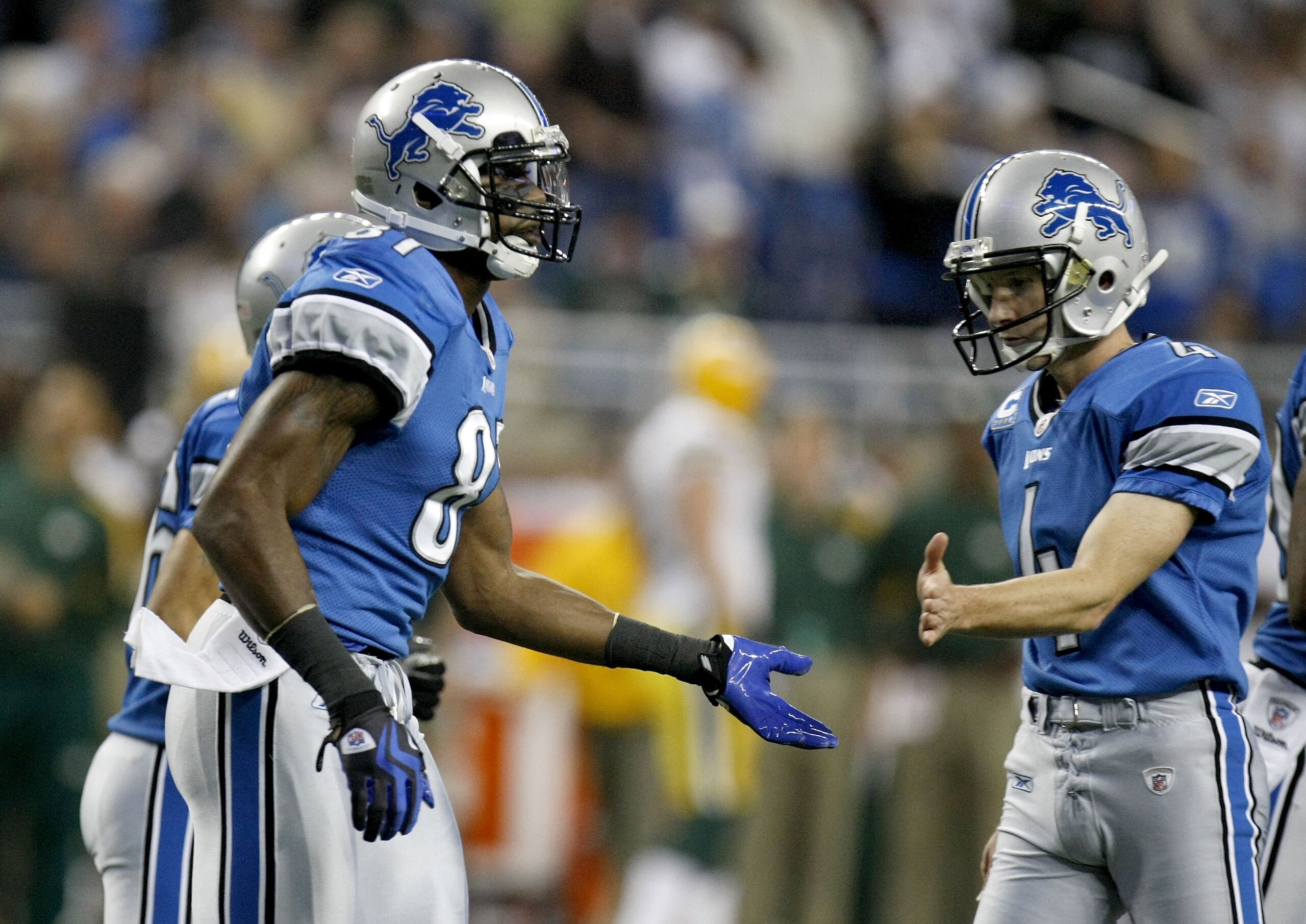 DETROIT , MI - NOVEMBER 26:  Calvin Johnson #81 of the Detroit Lions celebrates a first quarter touchdown with Jason Hanson while playing the Green Bay Packers on November 26, 2009 at Ford Field in Detroit, Michigan.  (Photo by Gregory Shamus/Getty Images