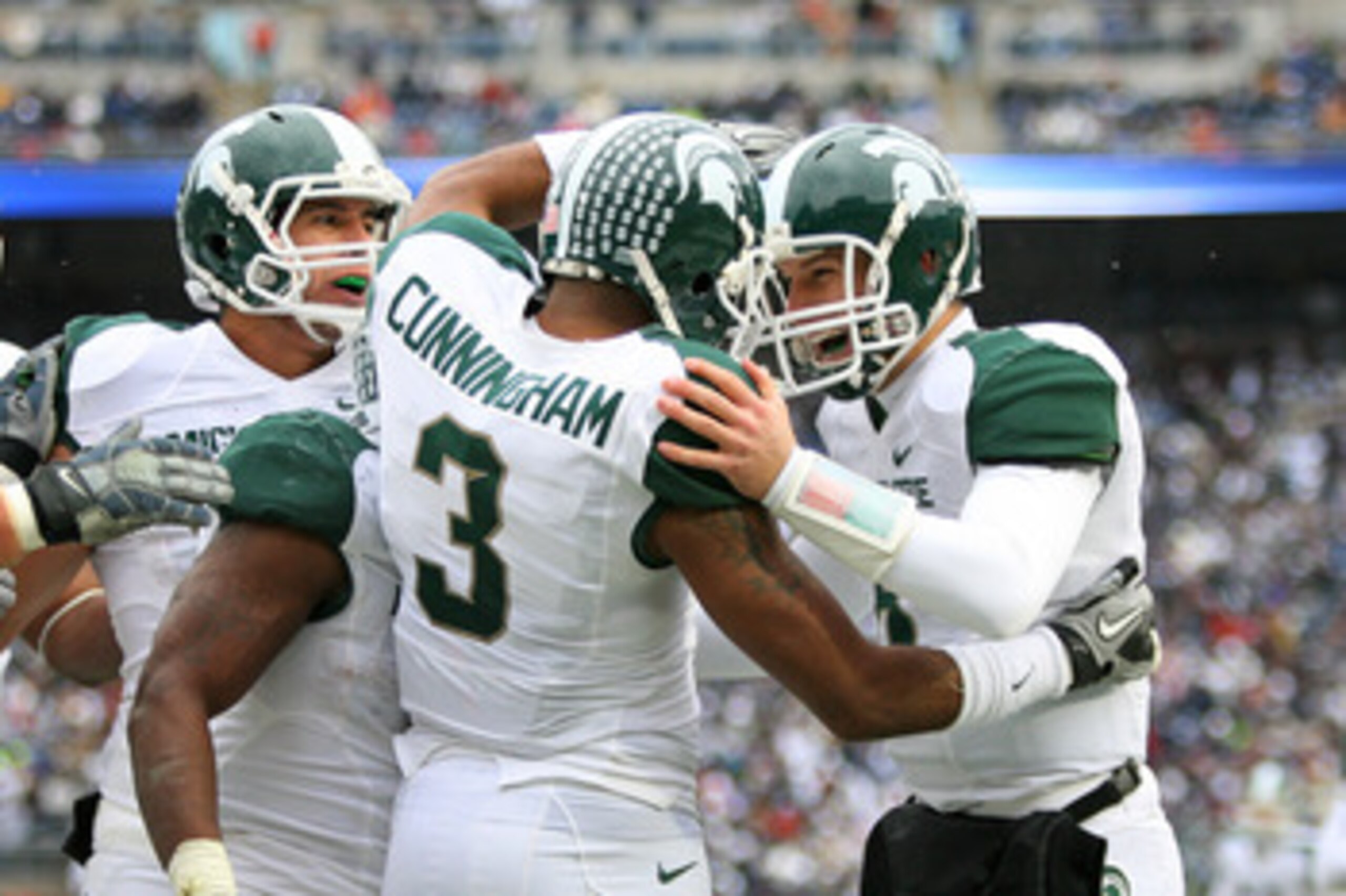 STATE COLLEGE, PA - NOVEMBER 27: Wide receiver B.J. Cunningham #3 celebrates his touchdown with quarterback Kirk Cousins #8 of the Michigan State Spartans during a game against the Penn State Nittany Lions on November 27, 2010 at Beaver Stadium in State C