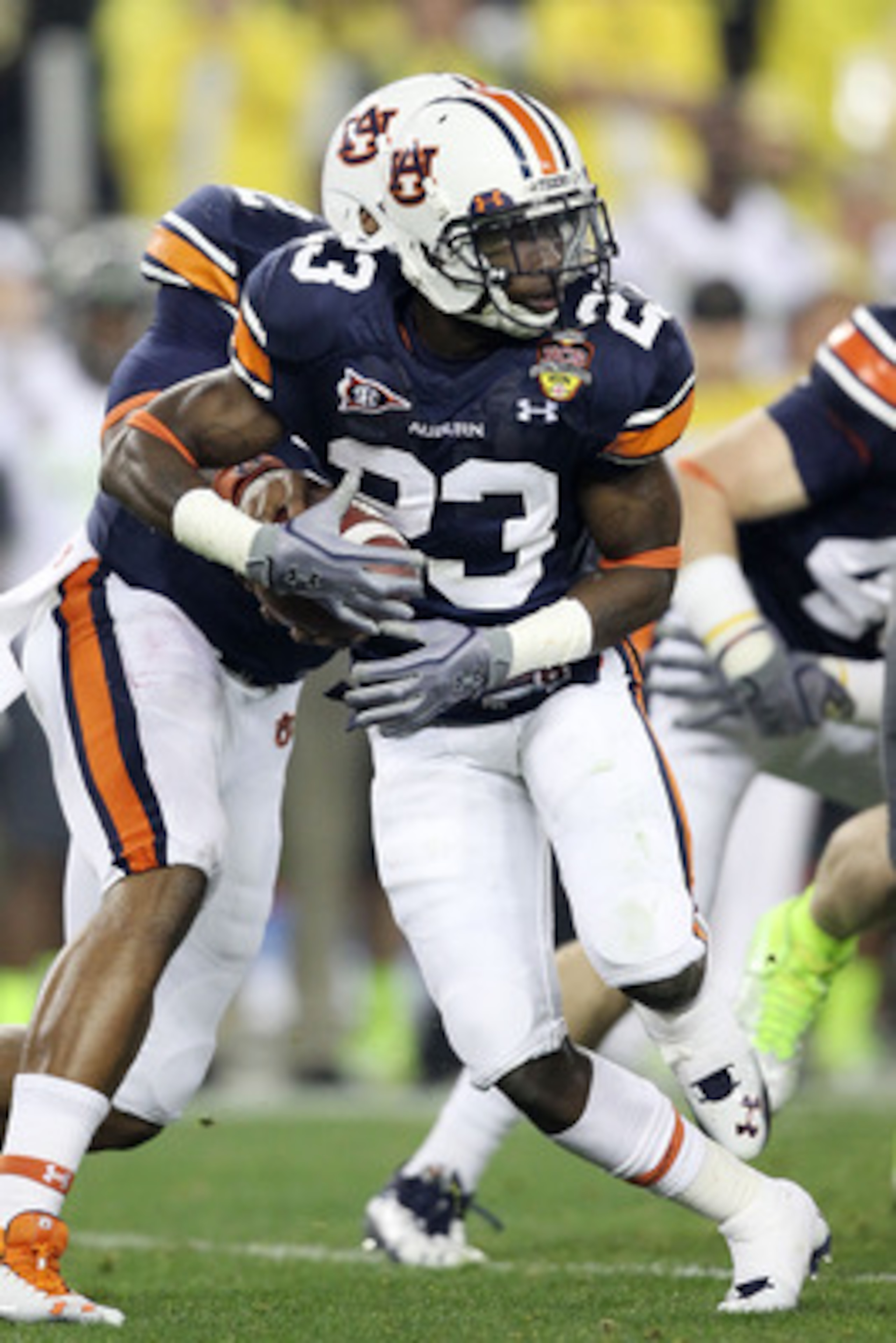 GLENDALE, AZ - JANUARY 10:  Onterio McCalebb #23 of the Auburn Tigers runs down field against the Oregon Ducks during the Tostitos BCS National Championship Game at University of Phoenix Stadium on January 10, 2011 in Glendale, Arizona.  (Photo by Christi