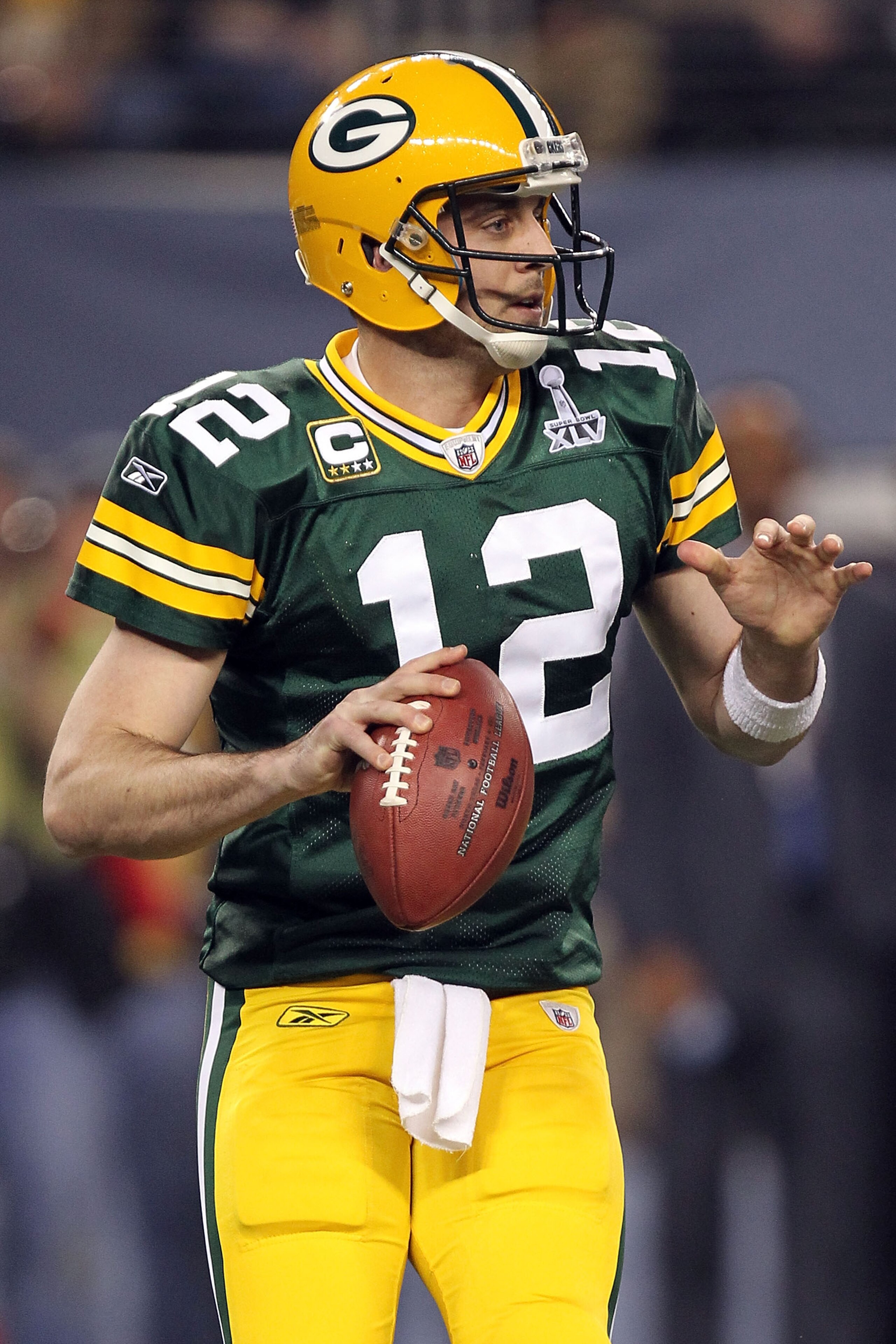 ARLINGTON, TX - FEBRUARY 06:  Aaron Rodgers #12 of the Green Bay Packers drops back against the Pittsburgh Steelers during the first quarter of Super Bowl XLV at Cowboys Stadium on February 6, 2011 in Arlington, Texas.  (Photo by Ronald Martinez/Getty Ima