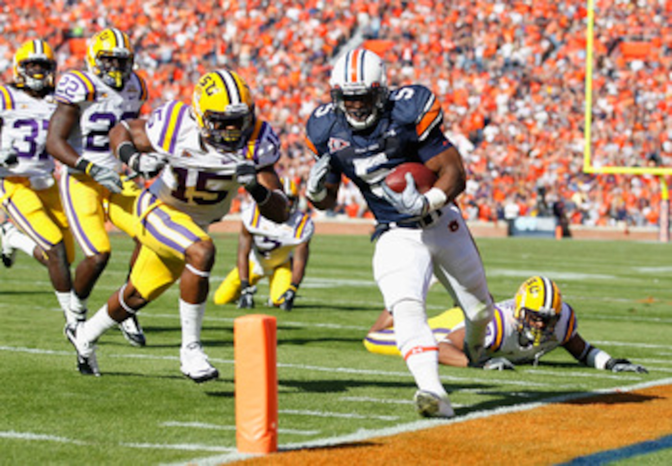AUBURN, AL - OCTOBER 23:  Michael Dyer #5 of the Auburn Tigers against Brandon Taylor #15 of the LSU Tigers at Jordan-Hare Stadium on October 23, 2010 in Auburn, Alabama.  (Photo by Kevin C. Cox/Getty Images)