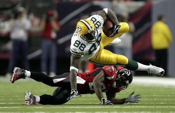 ATLANTA - NOVEMBER 13:  Bubba Franks #88 of the Green Bay Packers is tackled by DeAngelo Hall #21 of the Atlanta Falcons during their game on November 13, 2005 at the Georgia Dome in Atlanta, Georgia.  (Photo By Streeter Lecka)