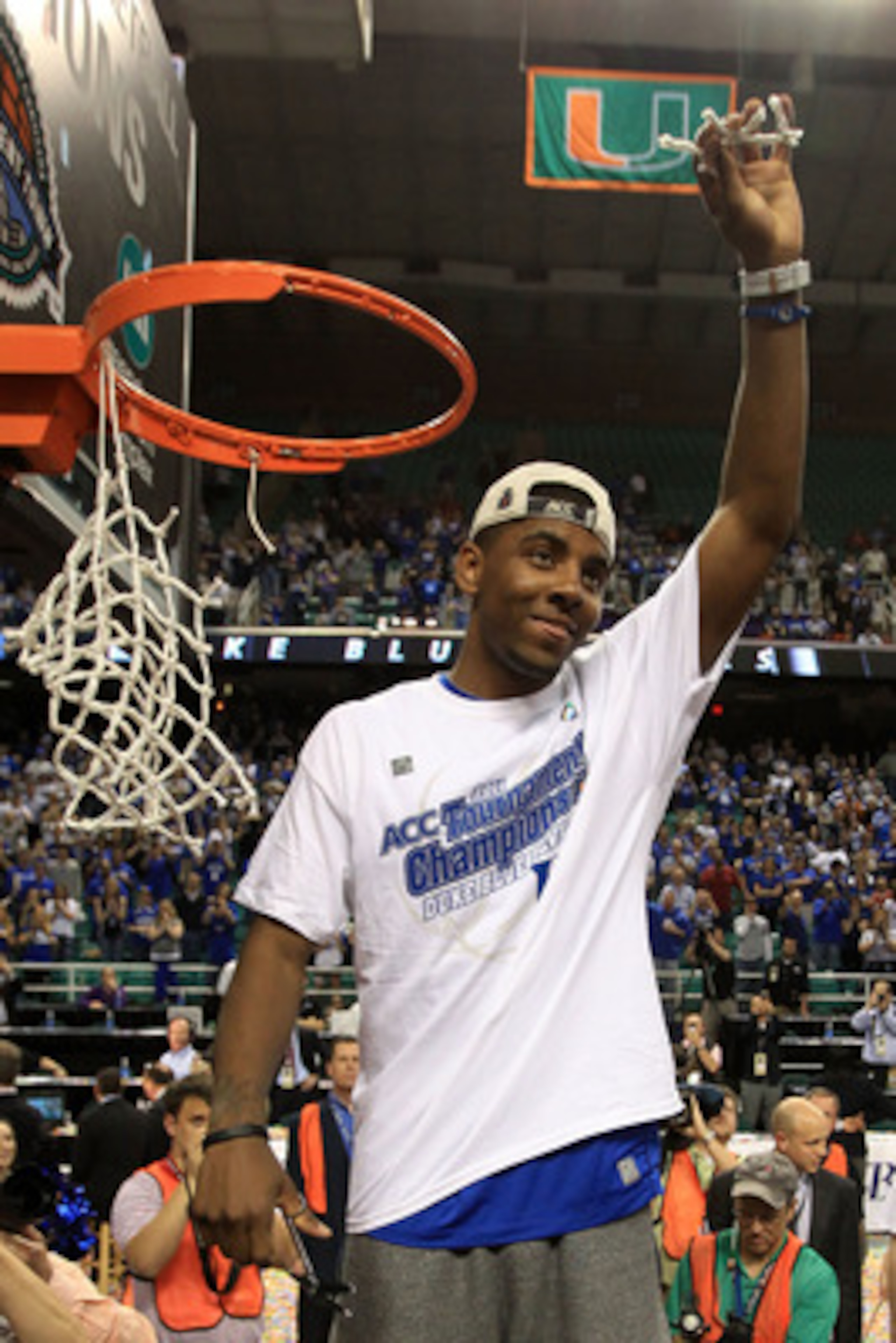 GREENSBORO, NC - MARCH 13:  Kyrie Irving #1 of the Duke Blue Devils cuts down the net after defeating the North Carolina Tar Heels 75-58 in the championship game of the 2011 ACC men's basketball tournament at the Greensboro Coliseum on March 13, 2011 in G