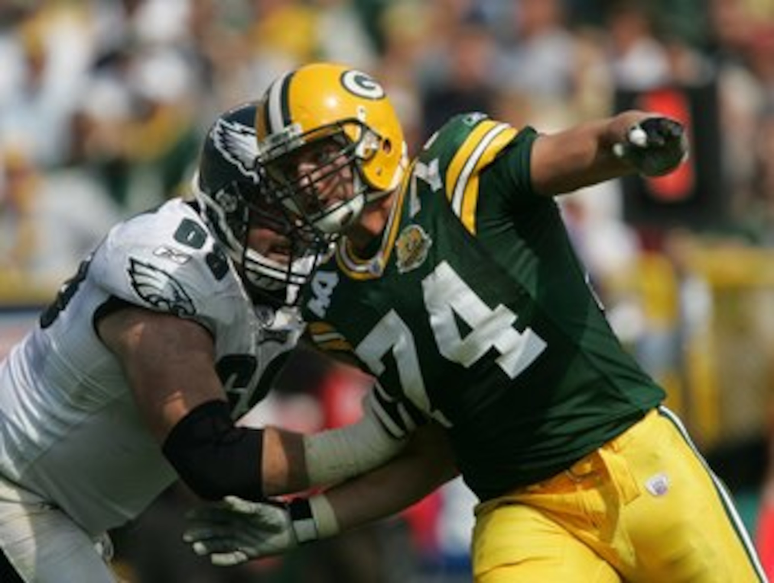 GREEN BAY, WI - SEPTEMBER 09: Aaron Kampman #74 of the Green Bay Packers rushes against Jon Runyan #69 of the Philadelphia Eagles on September 9, 2007 at Lambeau Field in Green Bay, Wisconsin. The Packers defeated the Eagles 16-13. (Photo by Jonathan Dani