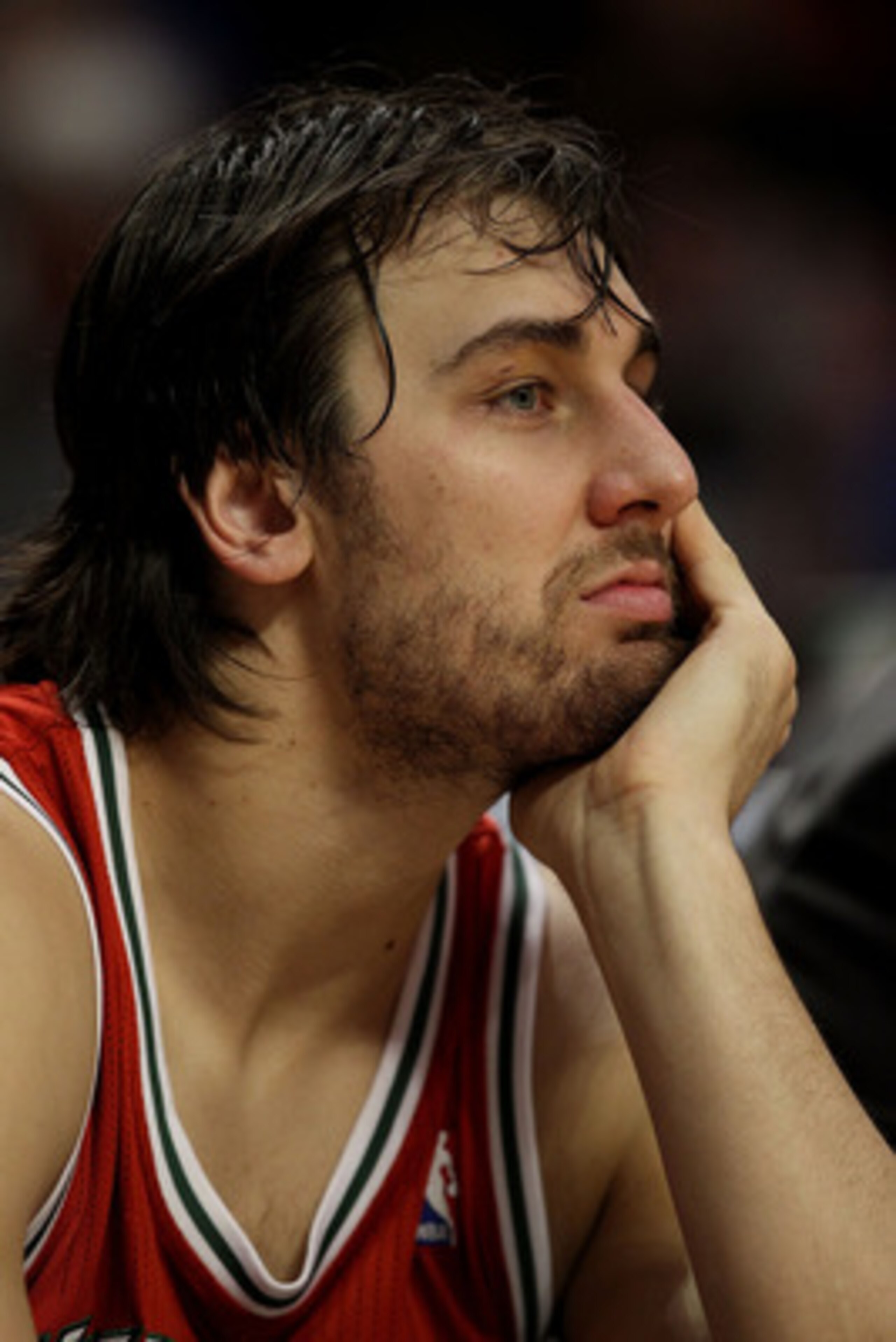 CHICAGO, IL - DECEMBER 28: Andrew Bogut #6 of the Milwaukee Bucks watches the final minutes of a game against the Chicago Bulls from the bench at the United Center on December 28, 2010 in Chicago, Illinois. The Bulls defeated the Bucks 90-77. NOTE TO USER