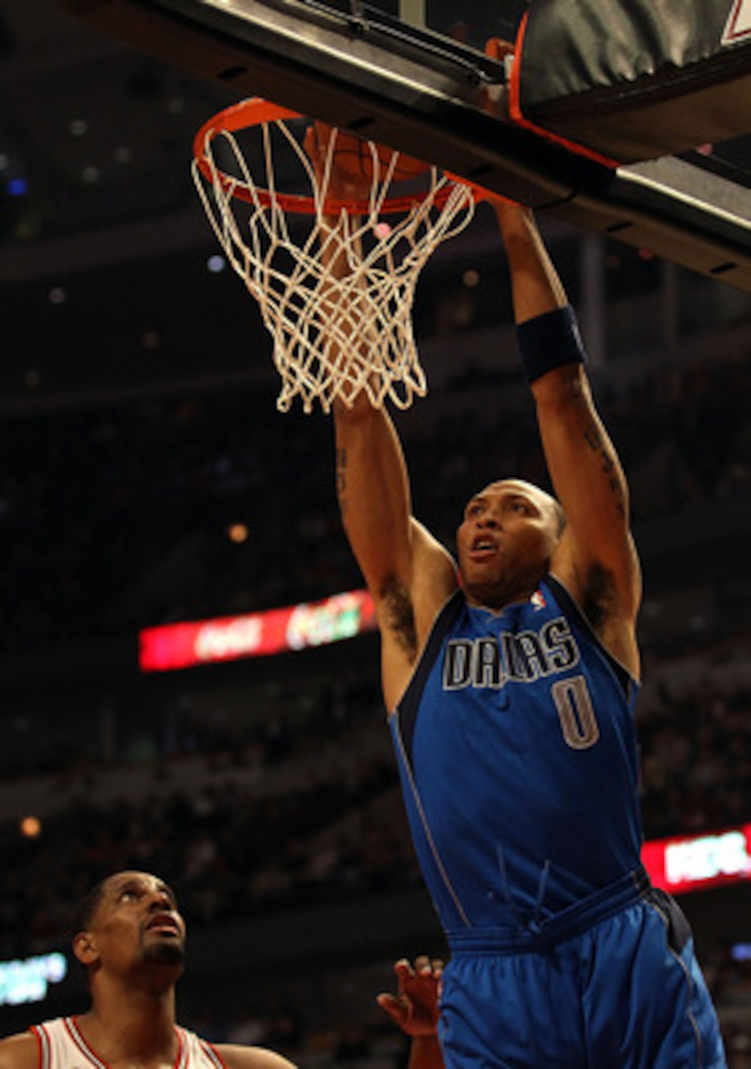 CHICAGO, IL - JANUARY 20: Shawn Marion #0 of the Dallas Mavericks dunks the ball over Kurt Thomas #40 of the Chicago Bulls at the United Center on January 20, 2011 in Chicago, Illinois. NOTE TO USER: User expressly acknowledges and agrees that, by downloa CHICAGO, IL - JANUARY 20: Shawn Marion #0 of the Dallas Mavericks dunks the ball over Kurt Thomas #40 of the Chicago Bulls at the United Center on January 20, 2011 in Chicago, Illinois. NOTE TO USER: User expressly acknowledges and agrees that, by downloa