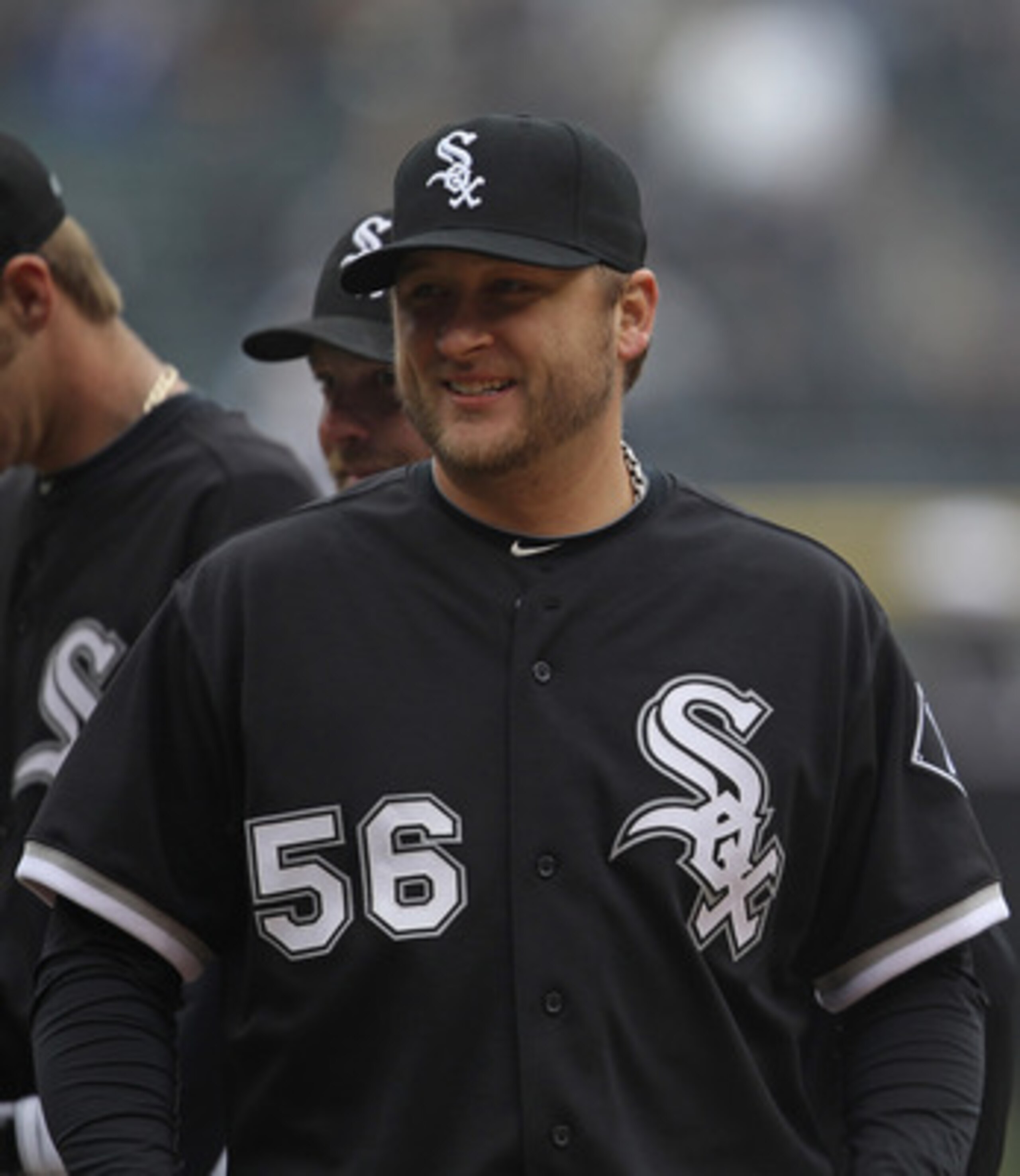 CHICAGO, IL - APRIL 07: Mark Buehrle #56 of the Chicago White Sox smiles at fans during player introductions before the home opener against the Tampa Bay Rays at U.S. Cellular Field on April 7, 2011 in Chicago, Illinois. The White Sox defeated the Rays 5-