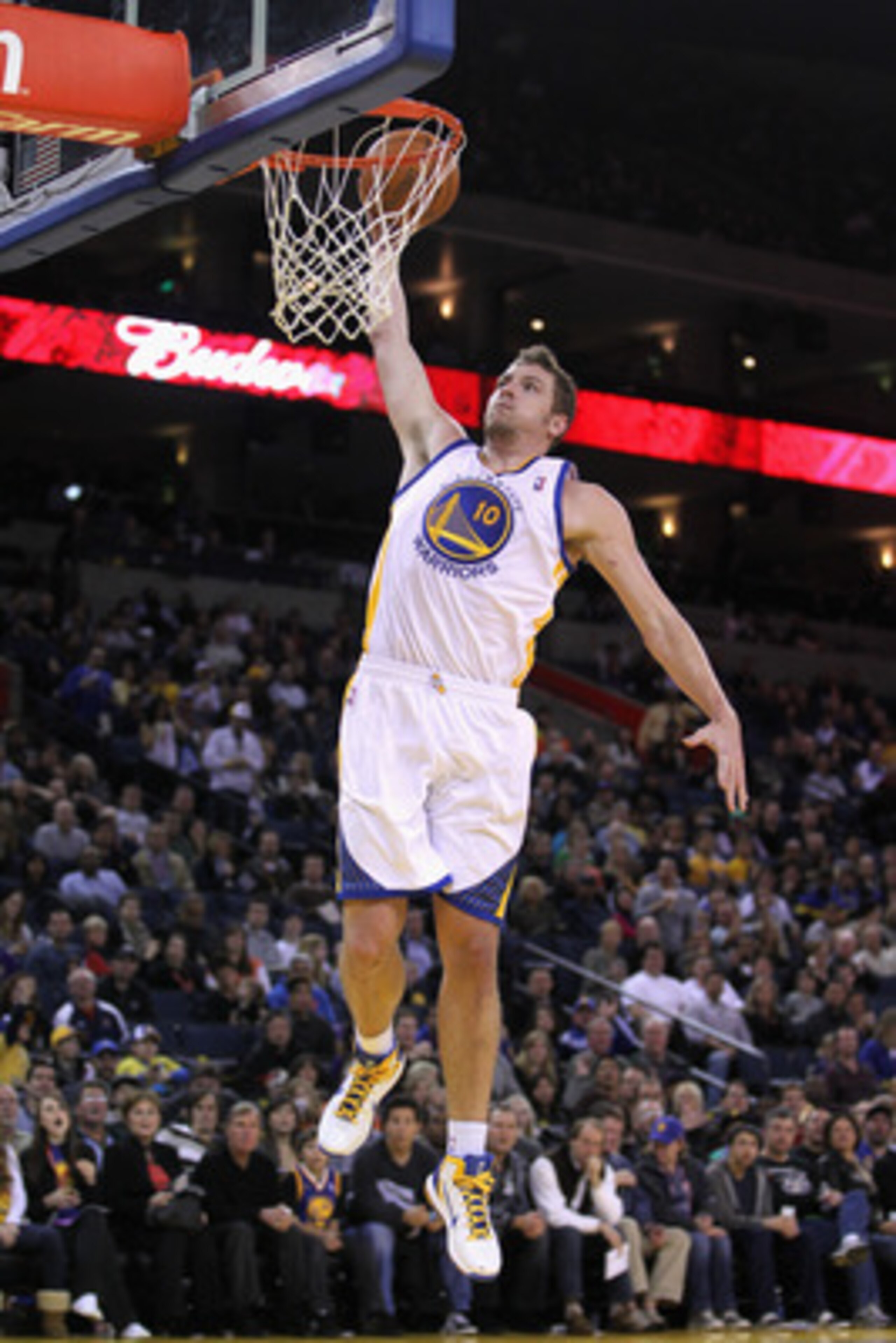 OAKLAND, CA - MARCH 25:  David Lee #10 of the Golden State Warriors in action against the Toronto Raptors at Oracle Arena on March 25, 2011 in Oakland, California. NOTE TO USER: User expressly acknowledges and agrees that, by downloading and or using this