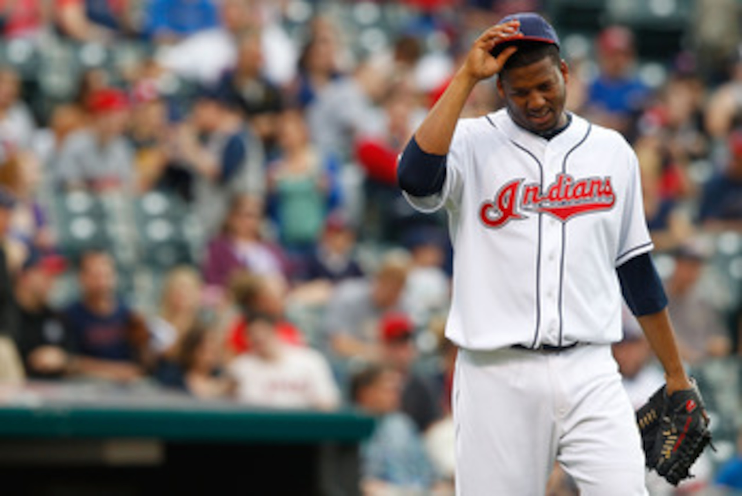 CLEVELAND - MAY 13:  Fausto Carmona #55 of the Cleveland Indians takes a moment to himself before pitching against the Seattle Mariners during the game on May 13, 2011 at Progressive Field in Cleveland, Ohio.  (Photo by Jared Wickerham/Getty Images)