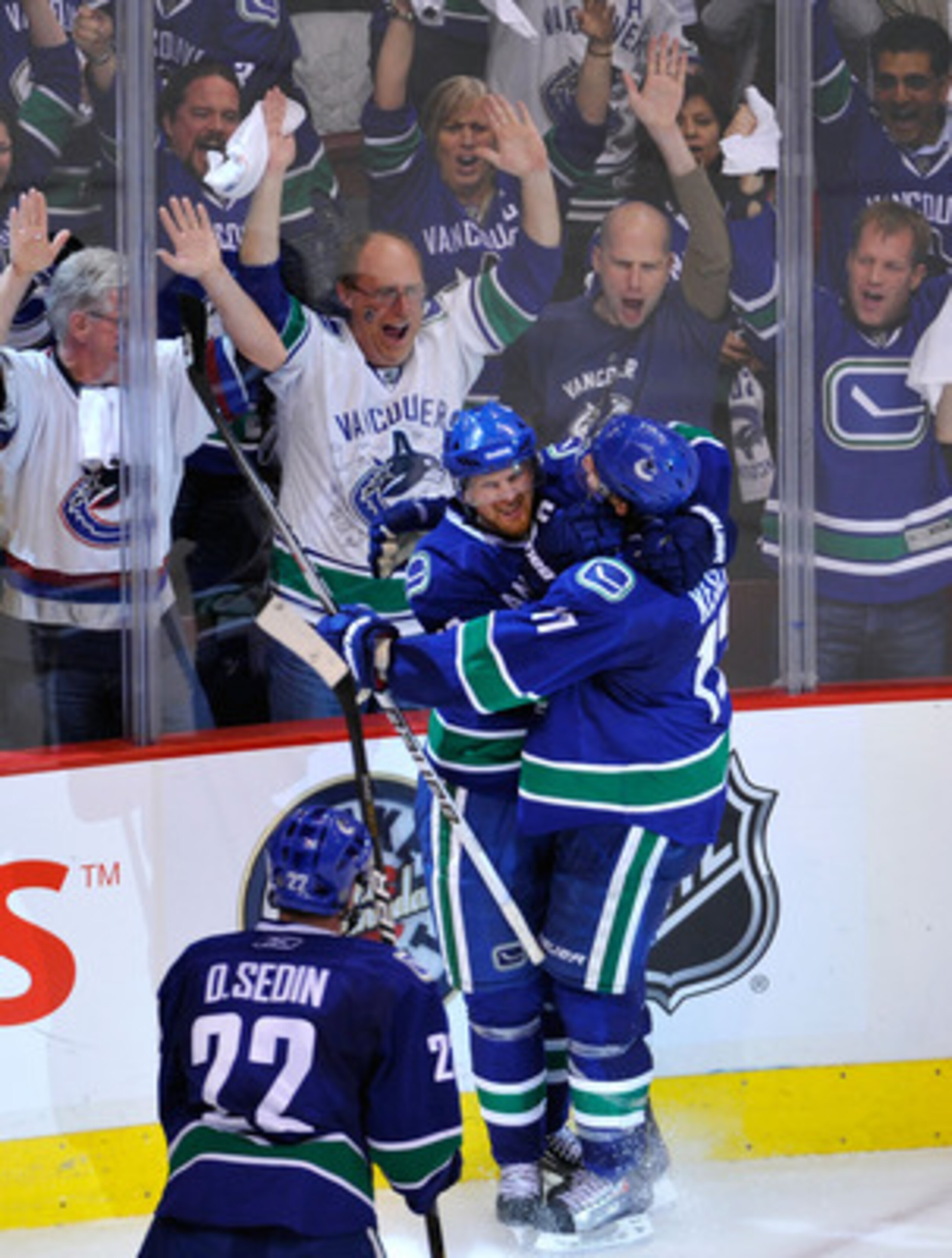 VANCOUVER, BC - MAY 15: Henrik Sedin #33 of the Vancouver Canucks celebrates with teammate Ryan Kesler #17 after his third period goal against the San Jose Sharks in Game One of the Western Conference Finals during the 2011 Stanley Cup Playoffs at Rogers VANCOUVER, BC - MAY 15: Henrik Sedin #33 of the Vancouver Canucks celebrates with teammate Ryan Kesler #17 after his third period goal against the San Jose Sharks in Game One of the Western Conference Finals during the 2011 Stanley Cup Playoffs at Rogers