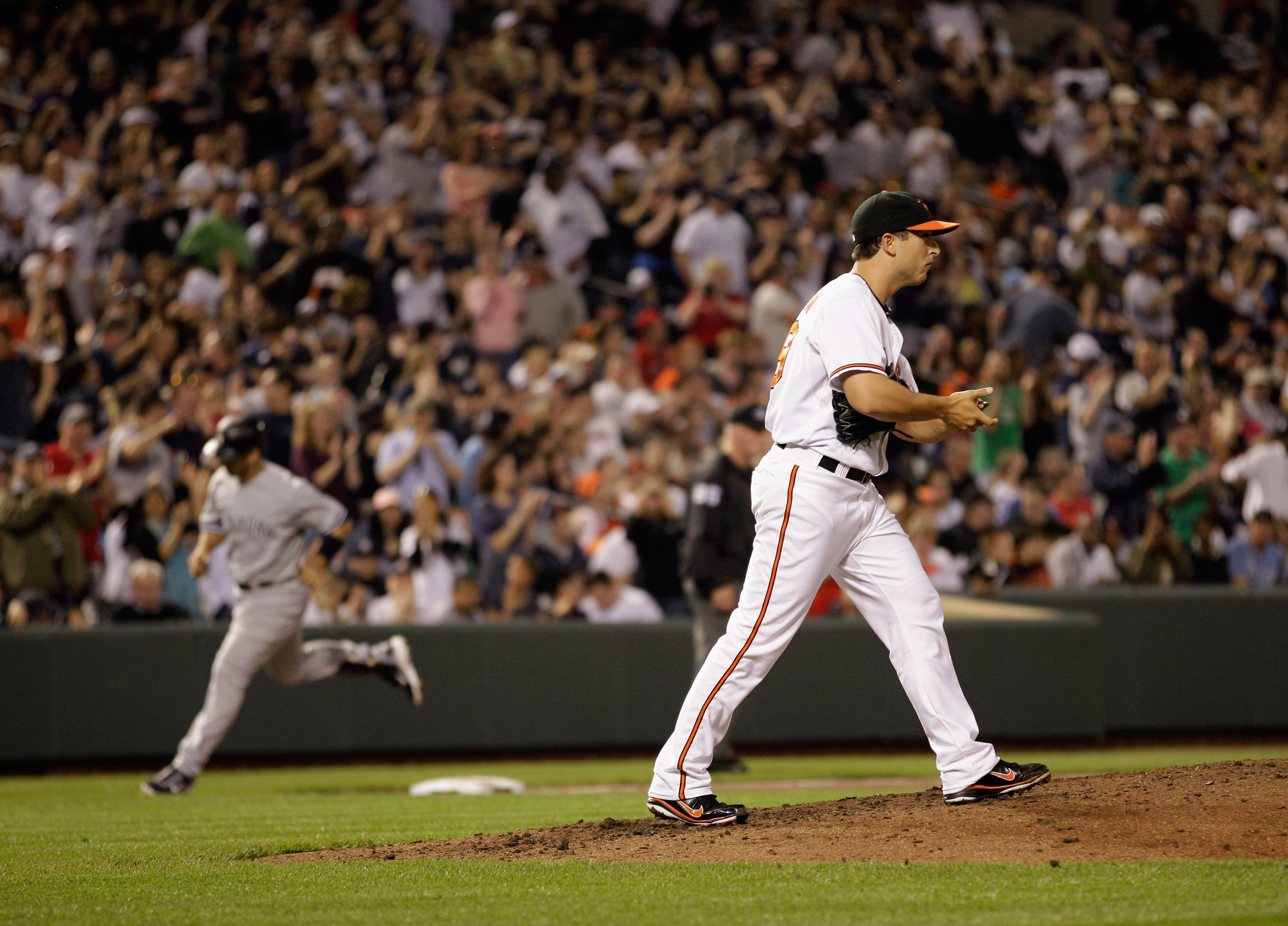 BALTIMORE, MD - APRIL 23: Jorge Posada #20 of the New York Yankees rounds the bases after hitting a homerun off of pitcher Jason Berken #49 of the Baltimore Orioles at Oriole Park at Camden Yards on April 23, 2011 in Baltimore, Maryland. (Photo by Rob C BALTIMORE, MD - APRIL 23: Jorge Posada #20 of the New York Yankees rounds the bases after hitting a homerun off of pitcher Jason Berken #49 of the Baltimore Orioles at Oriole Park at Camden Yards on April 23, 2011 in Baltimore, Maryland. (Photo by Rob C