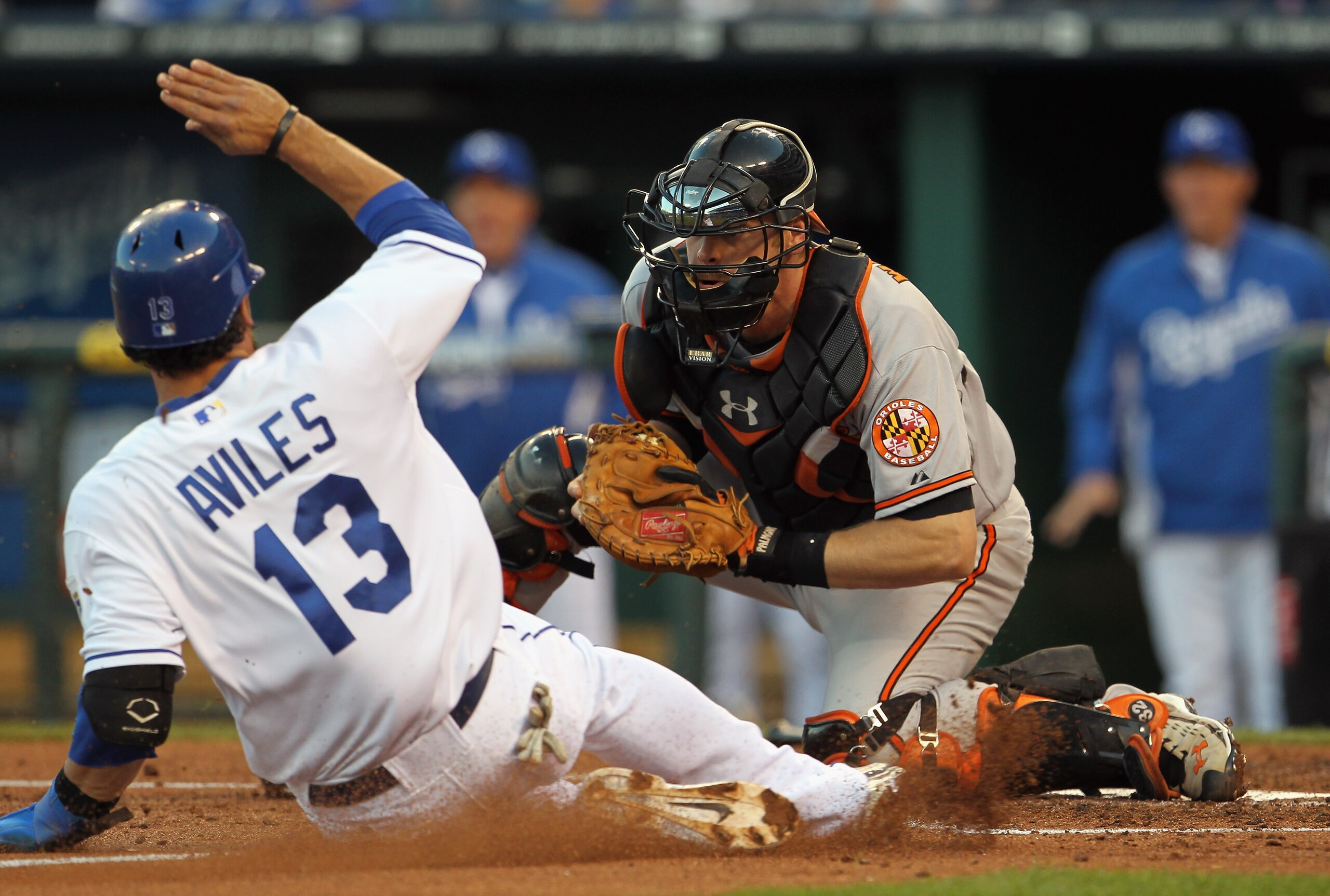 KANSAS CITY, MO - MAY 03:  Catcher Matt Wieters #32 of the Baltimore Orioles tags out Mike Aviles #13 of the Kansas City Royals at home plate during the game on May 3, 2011 at Kauffman Stadium in Kansas City, Missouri.  (Photo by Jamie Squire/Getty Images