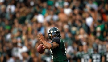 HONOLULU - SEPTEMBER 2:  Quarterback Bryant Moniz #17 of the University of Hawaii Warriors makes a pass against the University of Southern California Trojans during first half action at Aloha Stadium September 2, 2010 in Honolulu, Hawaii. (Photo by Kent N