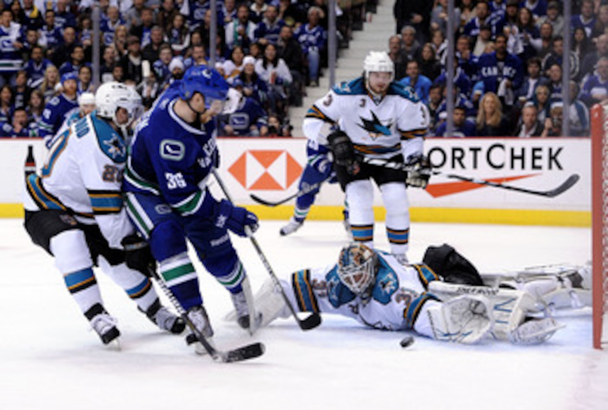 VANCOUVER, CANADA - MAY 15: Goaltender Antti Niemi #31 of the San Jose Sharks makes a save on shot by Jannik Hansen #36 of the Vancouver Canucks in the second period in Game One of the Western Conference Finals during the 2011 Stanley Cup Playoffs at Rog VANCOUVER, CANADA - MAY 15: Goaltender Antti Niemi #31 of the San Jose Sharks makes a save on shot by Jannik Hansen #36 of the Vancouver Canucks in the second period in Game One of the Western Conference Finals during the 2011 Stanley Cup Playoffs at Rog