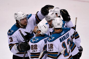 VANCOUVER, CANADA - MAY 15:  Douglas Murray #3, Dan Boyle #22, Devin Setoguchi #16 and Patrick Marleau #12 of the San Jose Shars congratulate Joe Thornton #19 after Thornton scored against the Vancouver Canucks in the first period in Game One of the Weste