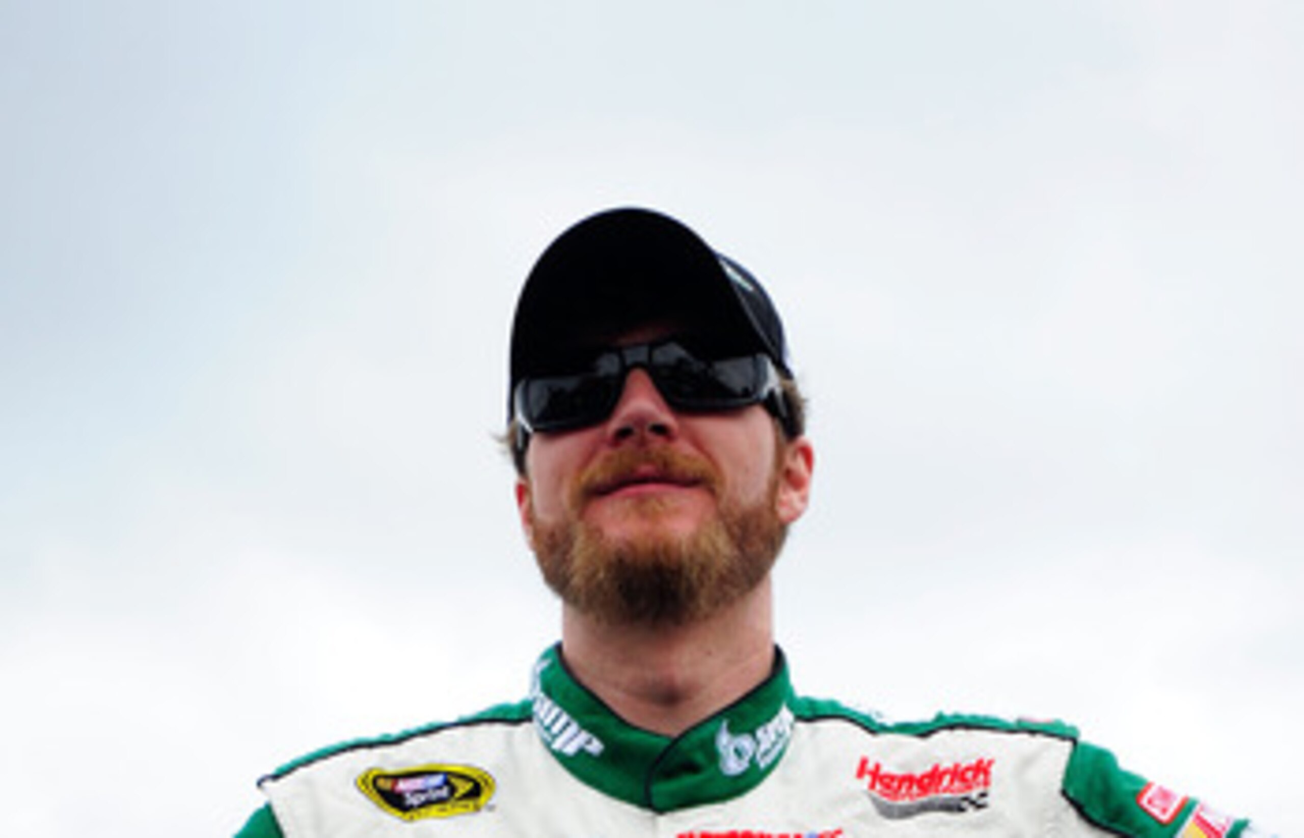 DOVER, DE - MAY 15:  Dale Earnhardt Jr., driver of the #88 Amp Energy Sugar Free/National Guard Chevrolet, stands on the grid prior to the NASCAR Sprint Cup Series FedEx 400 Benefiting Autism Speaks at Dover International Speedway on May 15, 2011 in Dover